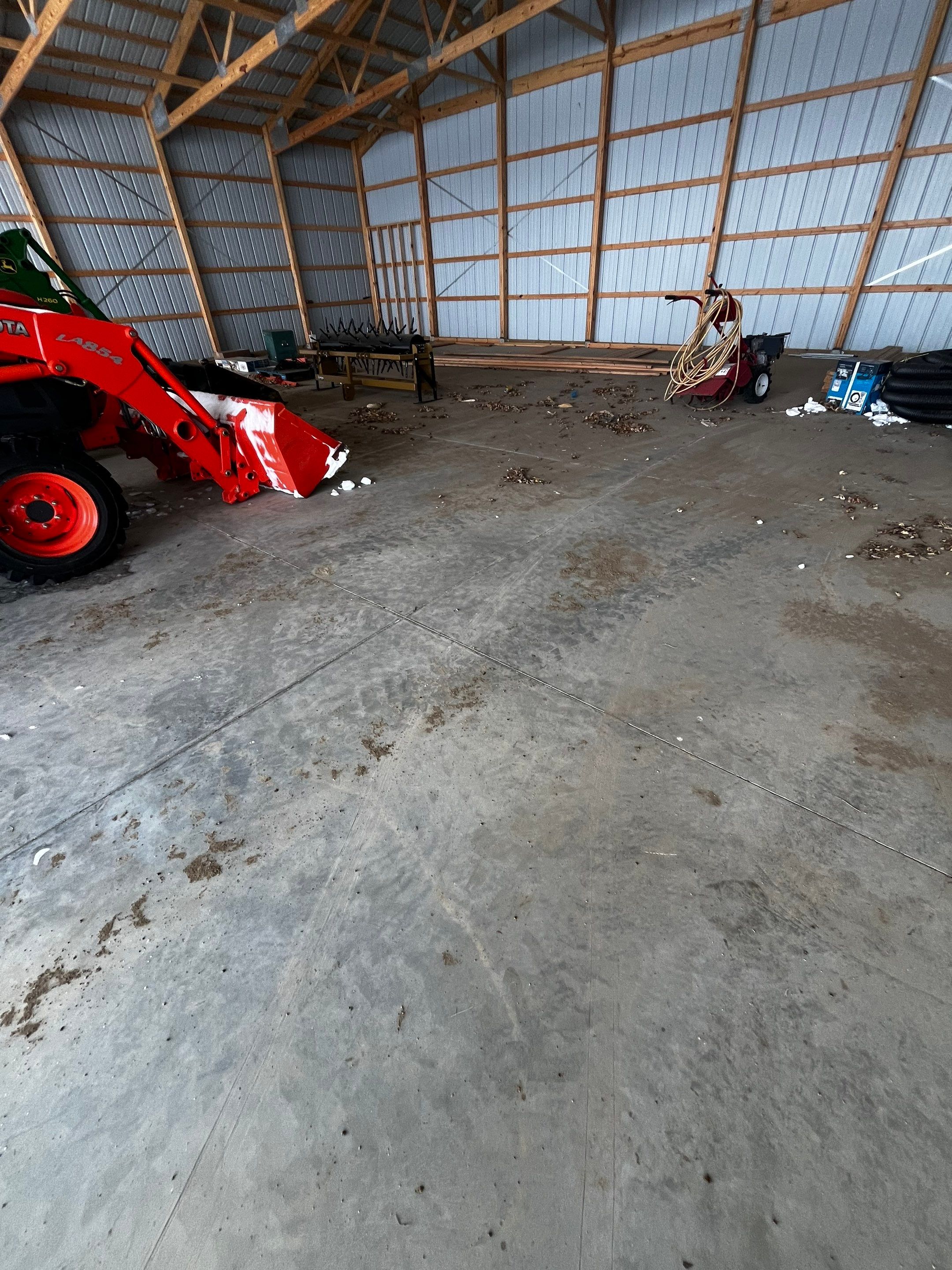 Durable Grey Speckled Epoxy Floor Coating for Yankton Shop by Select Painting, Coatings & Garage Cabinets
