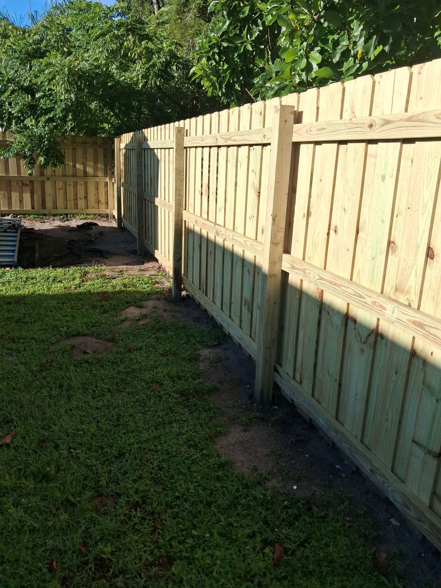 Pressure-Treated Wood Privacy Fence and Gate Installation in North Port by True Fence LLC