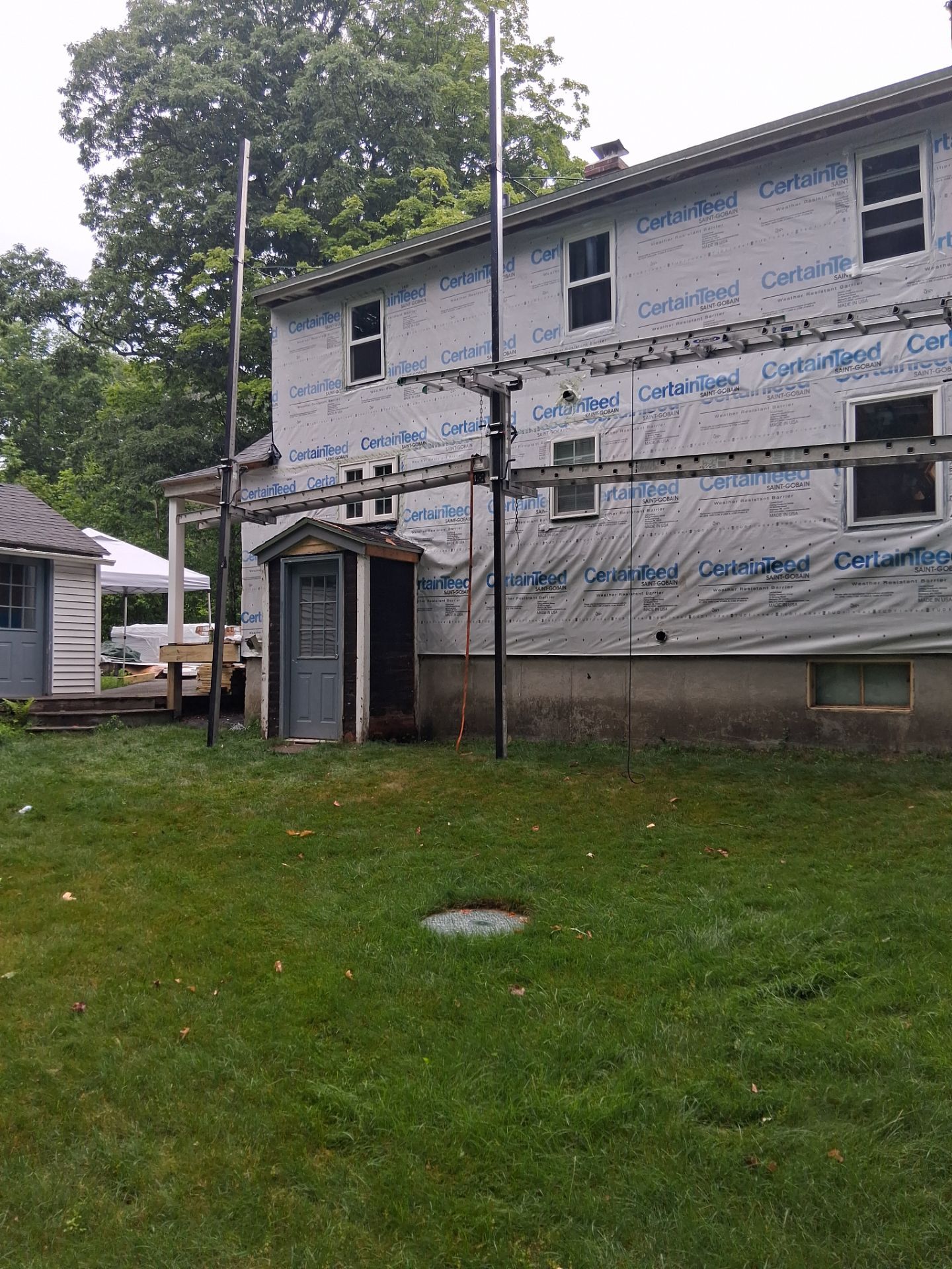 Complete Exterior Renovation Featuring Owens Corning Shingles and Vinyl Siding by Tall pine roofing