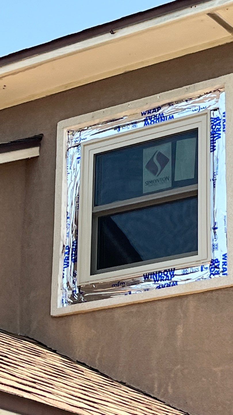 Installing Windows on a Submarine  by Bayfront Roofing and Construction