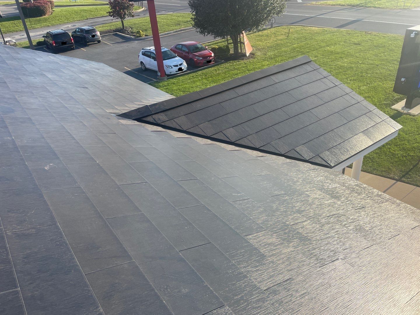 Tesla Solar Roof on a Commercial Building by American Home Contractors