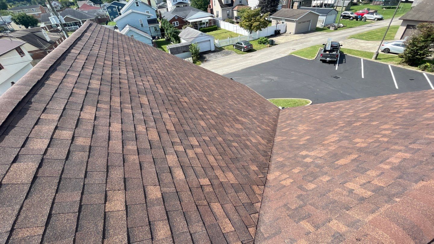 Commercial Roofing Installation using Performance Shingles by Mr. Roofer