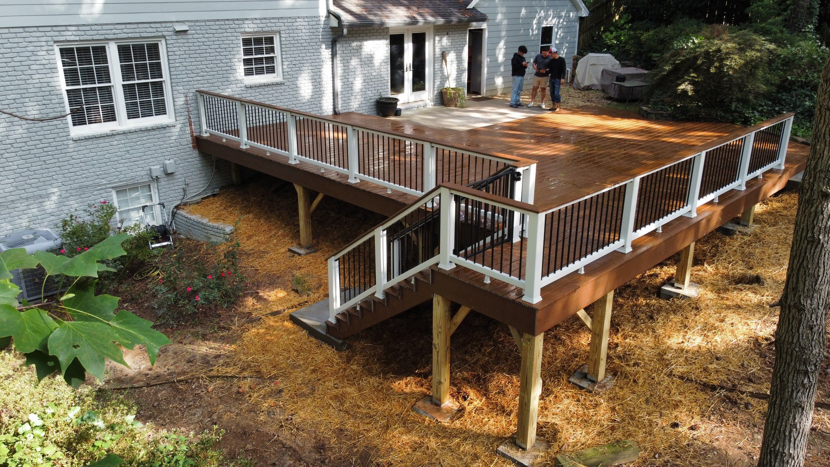Custom Stained Wood Deck Installation with White Railings in Atlanta by Swift Home Renovations