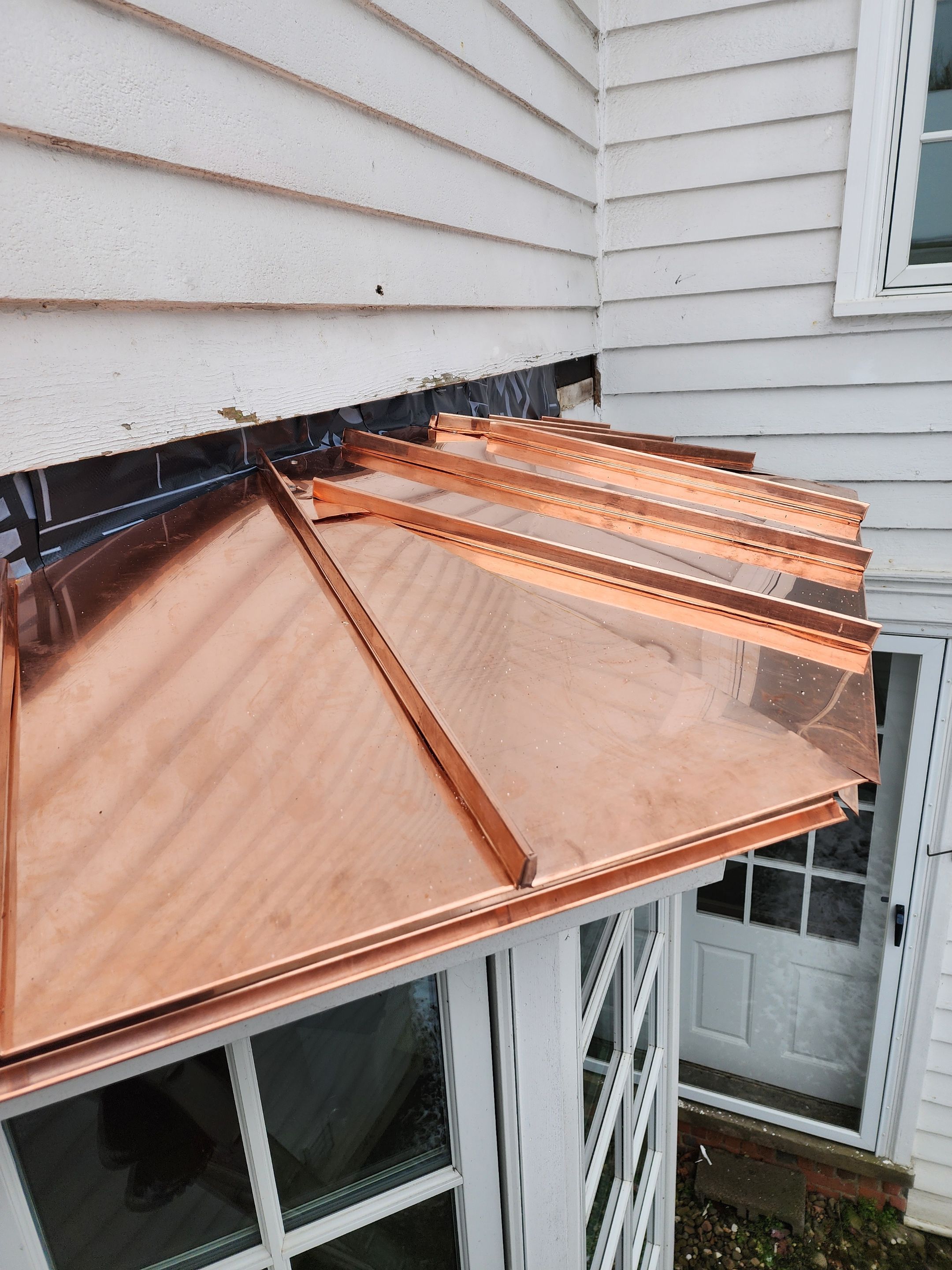 Copper Roof using Copper by Absolute Roofing and Construction