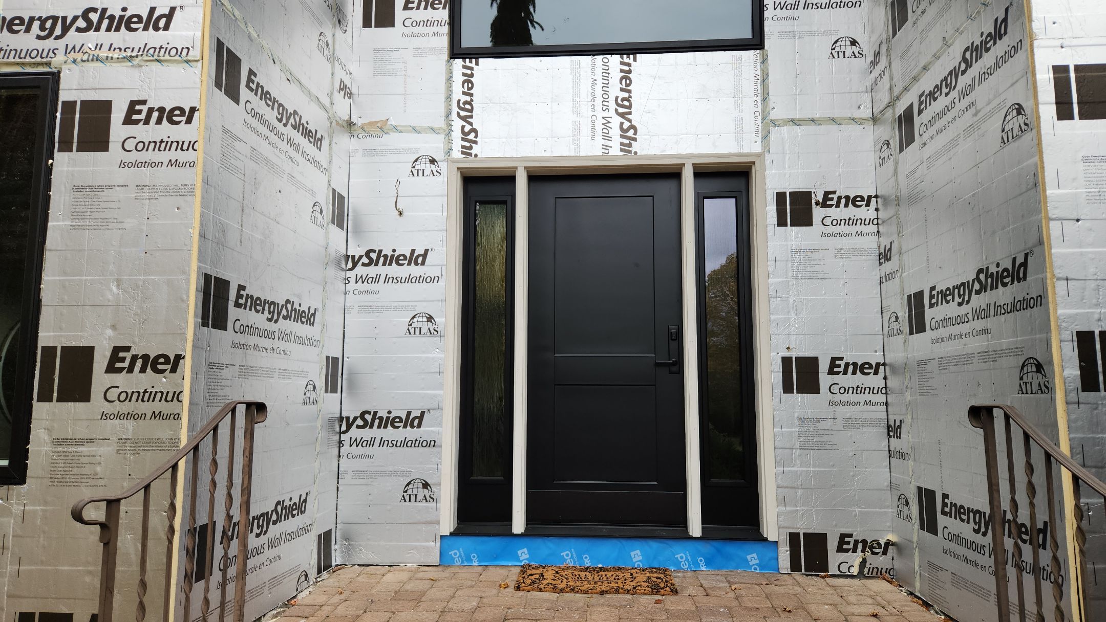 Bold Siding transformation with Cert Cedar Board & Batten S12, White, and Cert Monogram D/4 x 12'6" clapboard, Tuxedo by DiGiorgi Roofing and Siding Inc