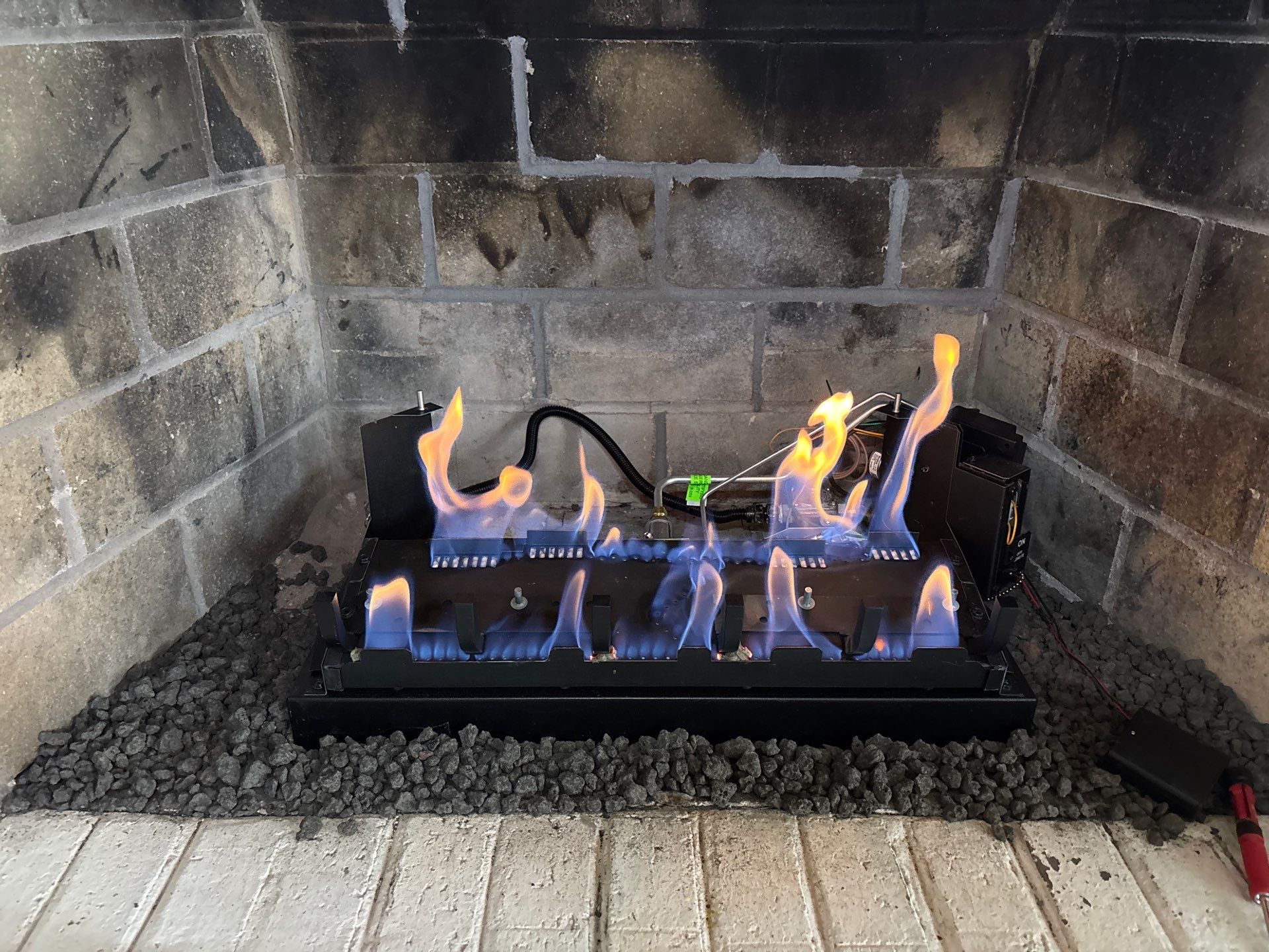 Gas Logs Installed in Smithfield by Premier Chimney and Roofing