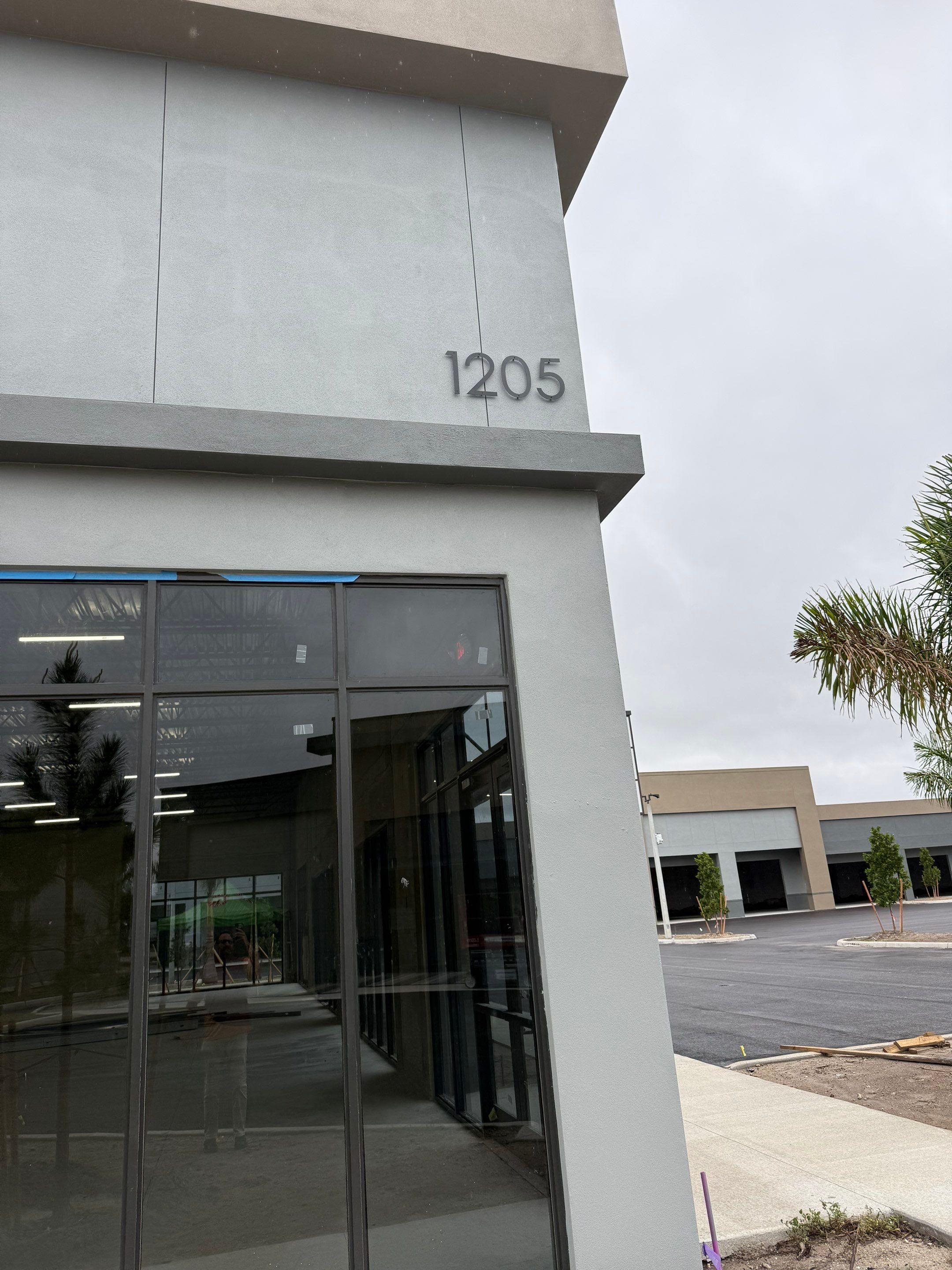 Downspout Installation using collector head in Cape Coral FL by Gutter Professors