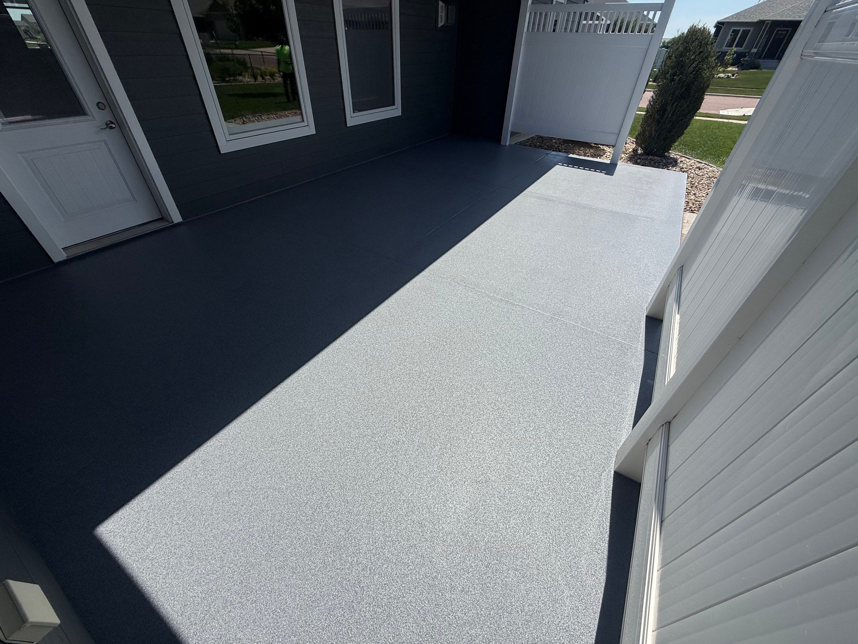 Polyurea Patio Floor Coating in Starry Evening for Sioux Falls Home by Select Painting, Coatings & Garage Cabinets