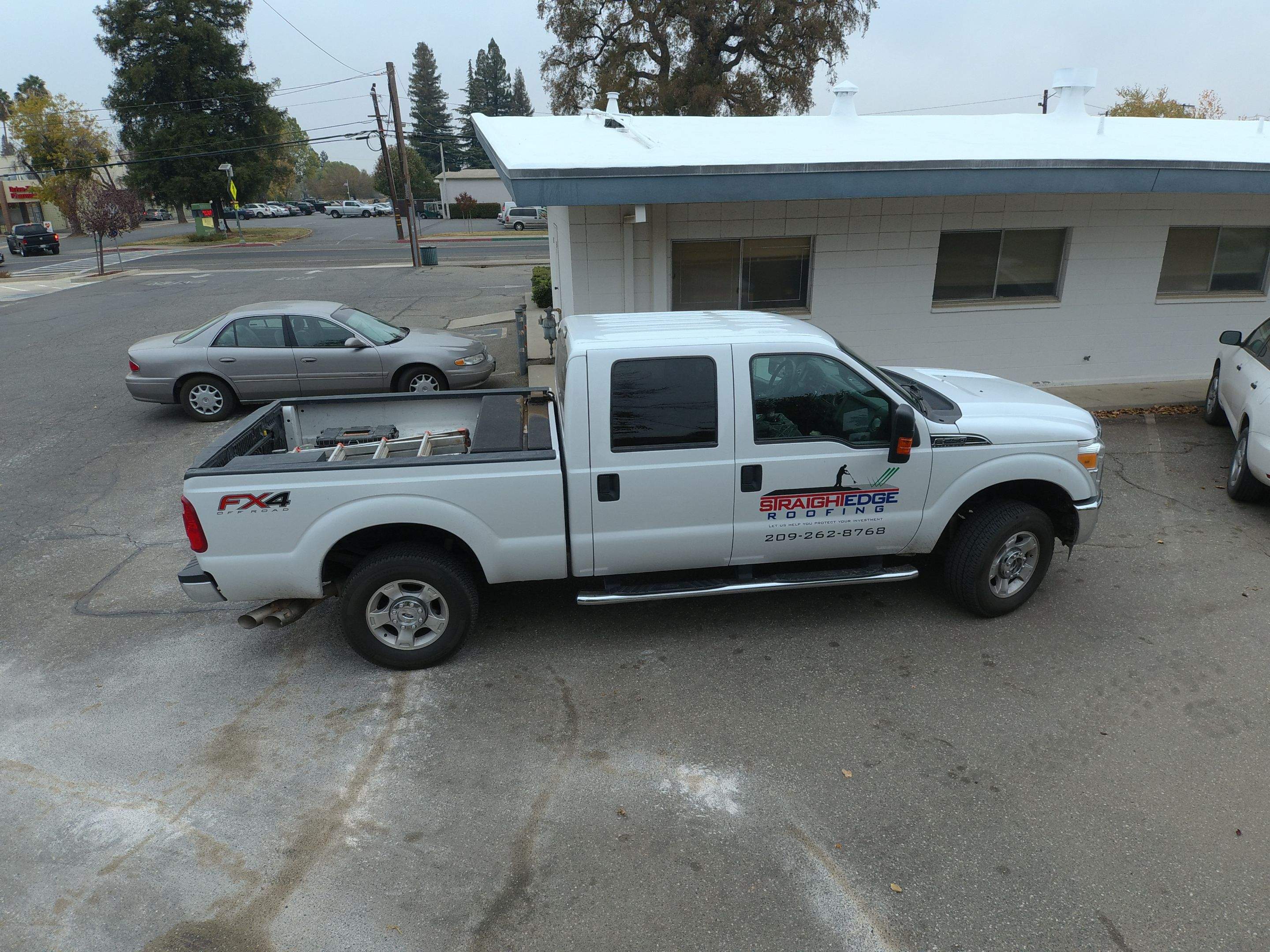 Spray foam and coatings using Conklin Benchmark/PUMA XL coatings and spray foam by Straight Edge Roofing Inc
