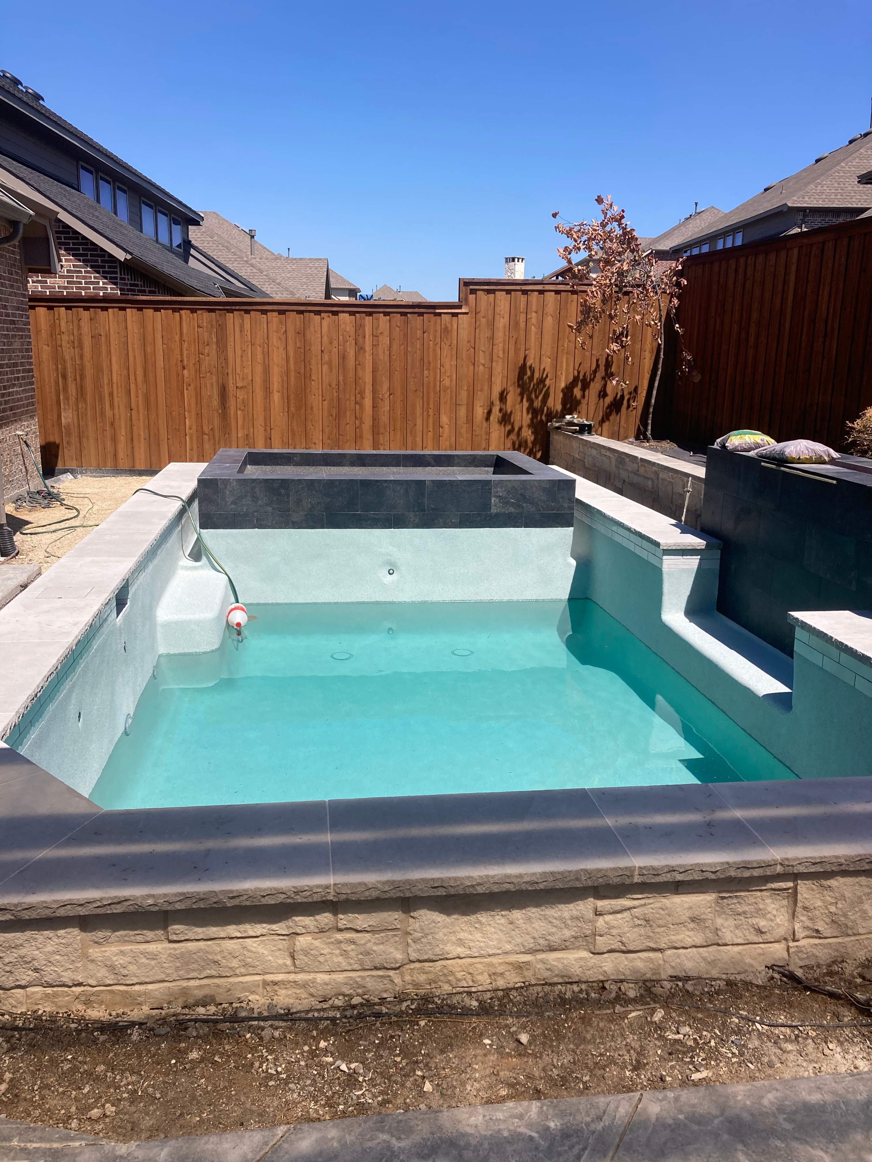 Geometric Pool with Tanning Ledge by Pinnacle Pools and Spas - DFW
