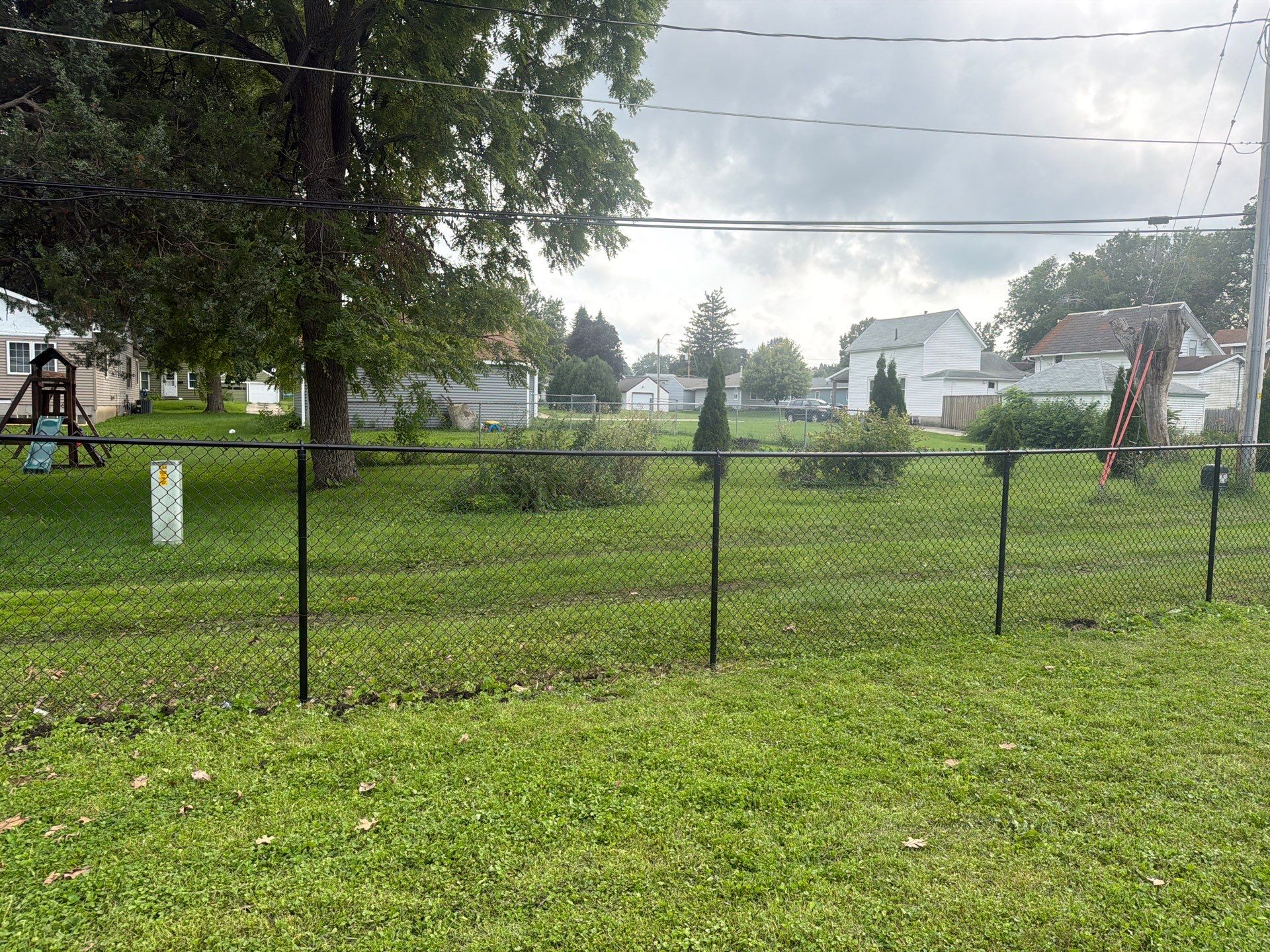 Residential Black Chain Link Fence Installation in Reinbeck by Perfect Picket Fence and Stain