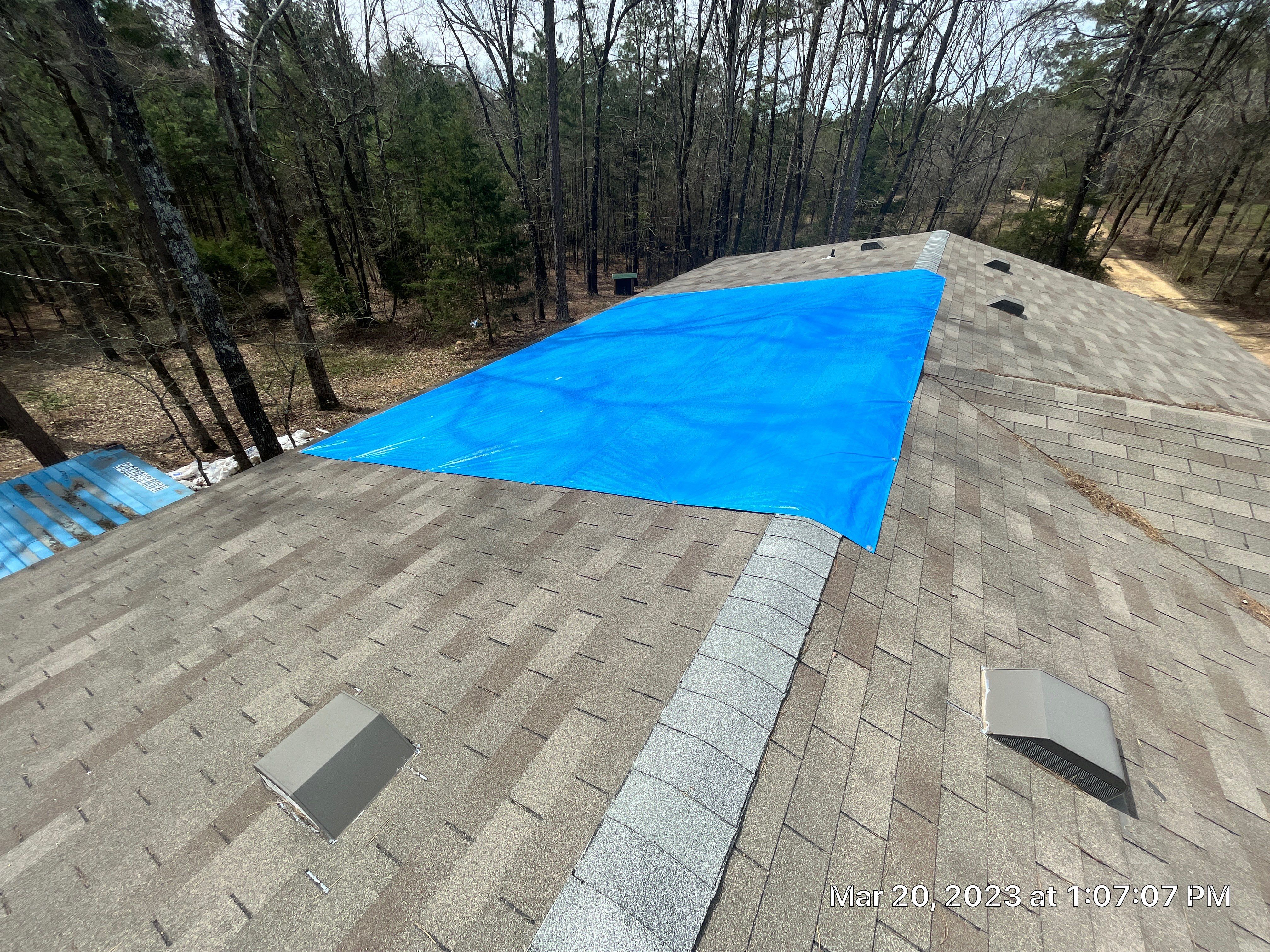 Residential Roofing Installation using 26 Gauge Colored Panels by Hostetler Roofing