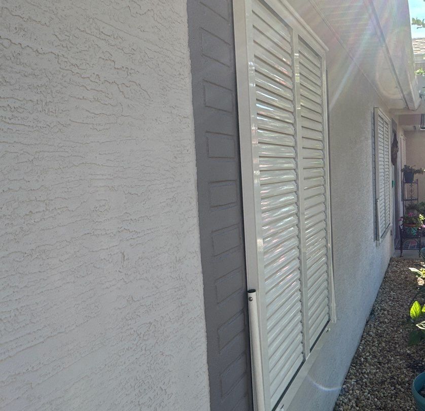 Hurricane Rated Bahama Shutters in Cream by Smart Guard Shutters