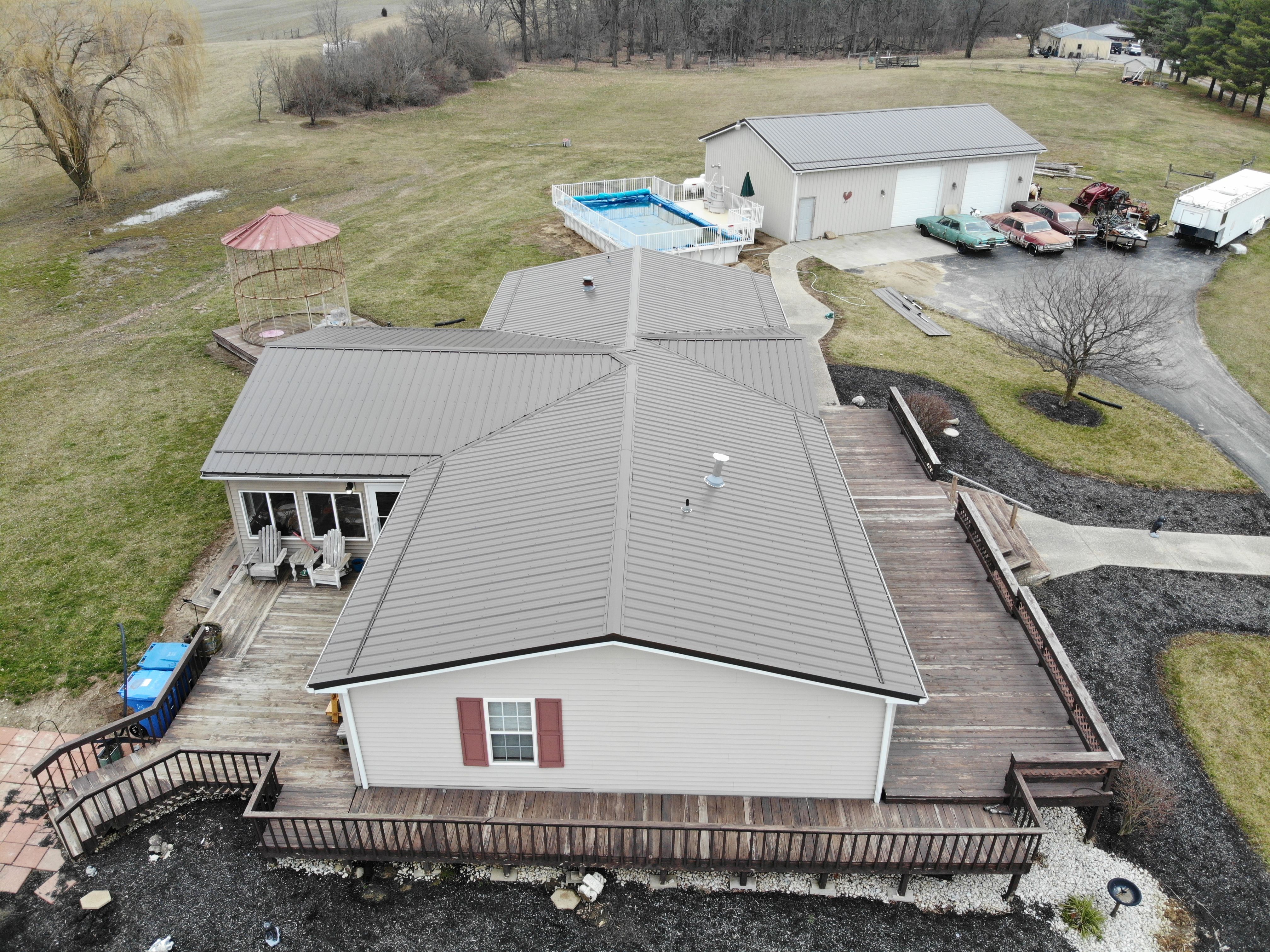 Exposed Fastener Metal Roof on Multi-Home Property in Columbia City, Indiana by 4Ever Metal Roofing