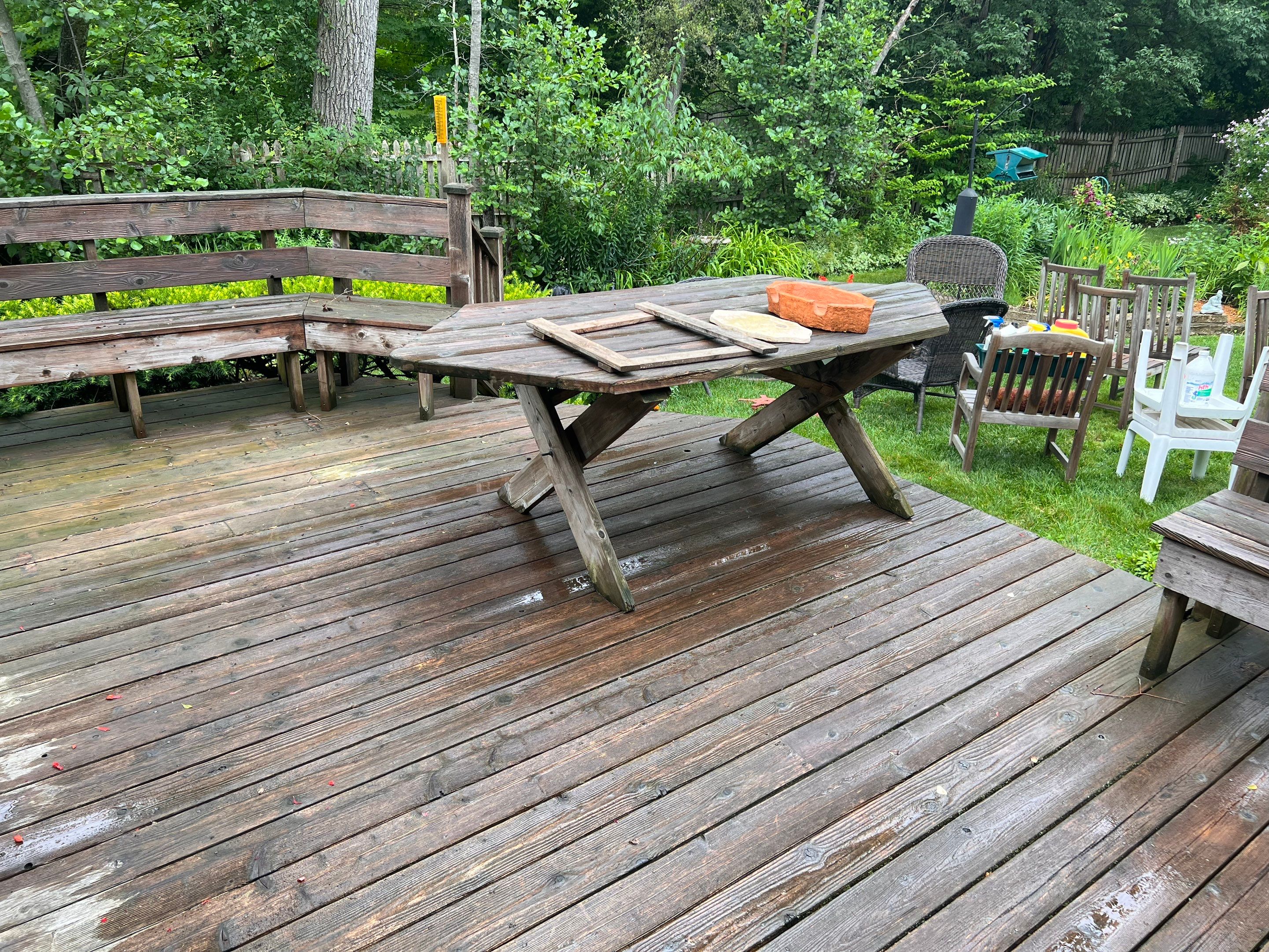 Wood deck cleaning, board replacement and staining by Northern Power Washing LLC.