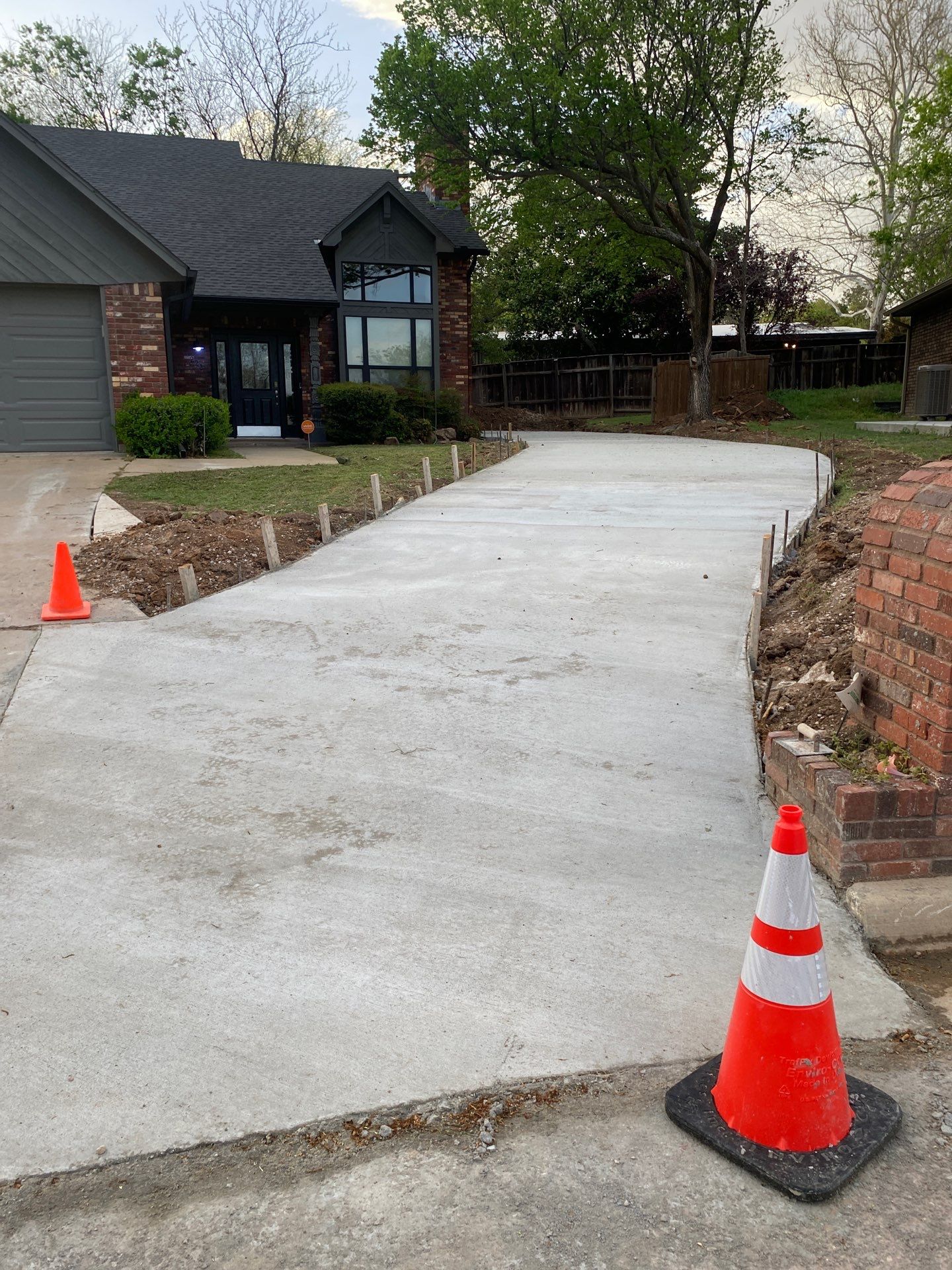 Concrete Driveway and Fence by Clays Services Inc