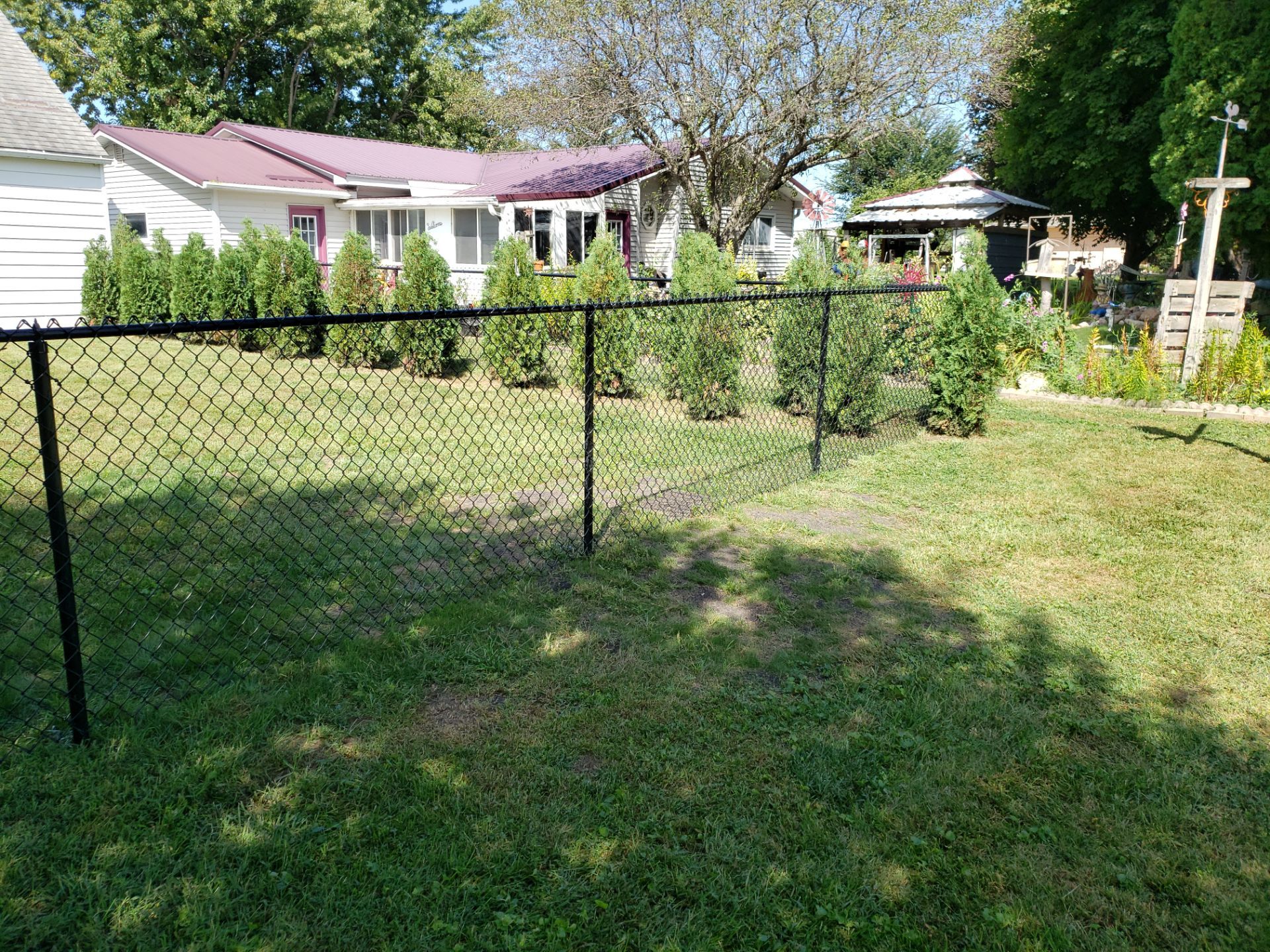 Residential Black Chain Link Fencing Project in Wellburg, Iowa by Perfect Picket Fence and Stain