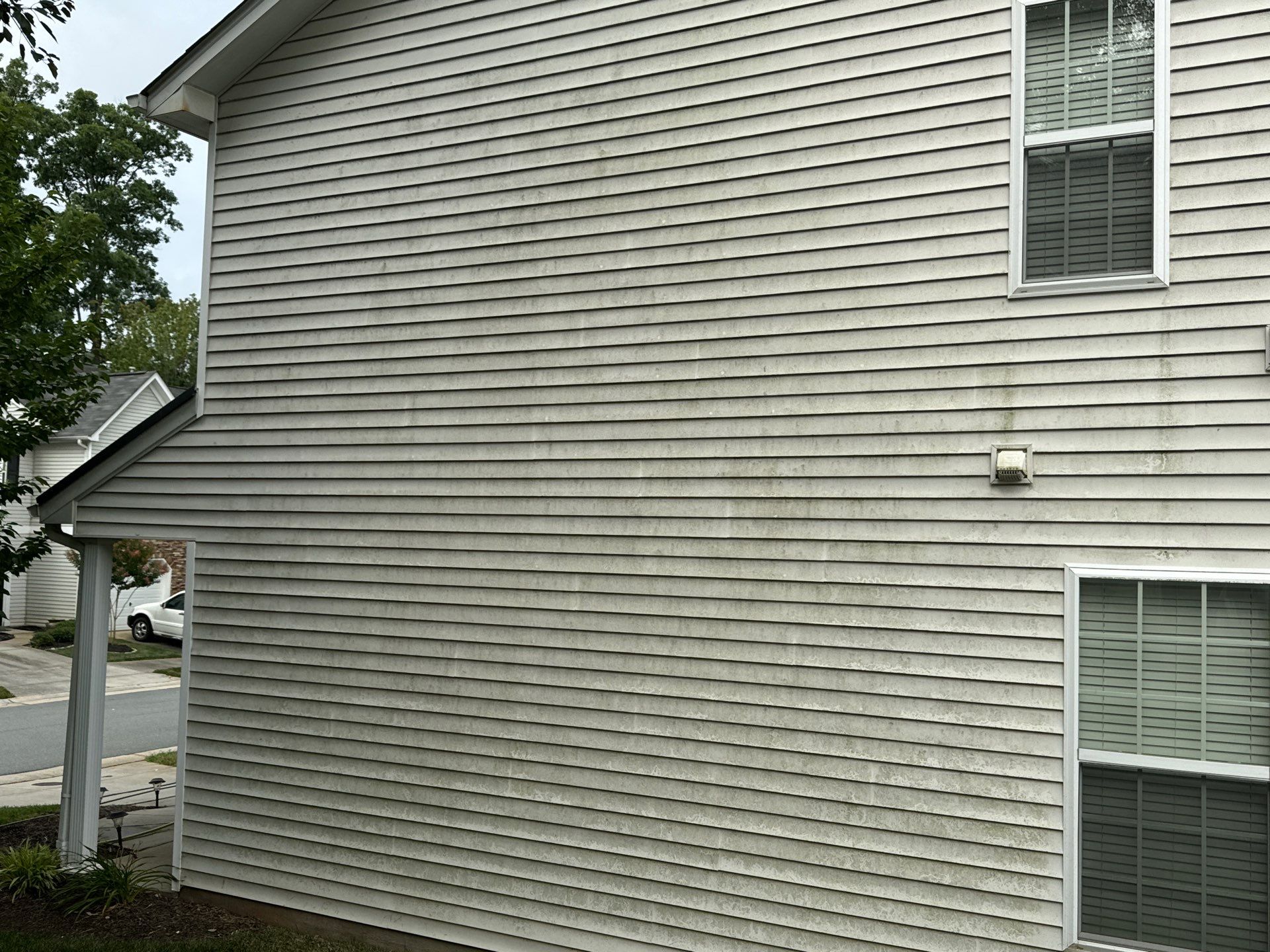 pressure washing vinyl siding to remove dirt mildew and stains restoring appearance