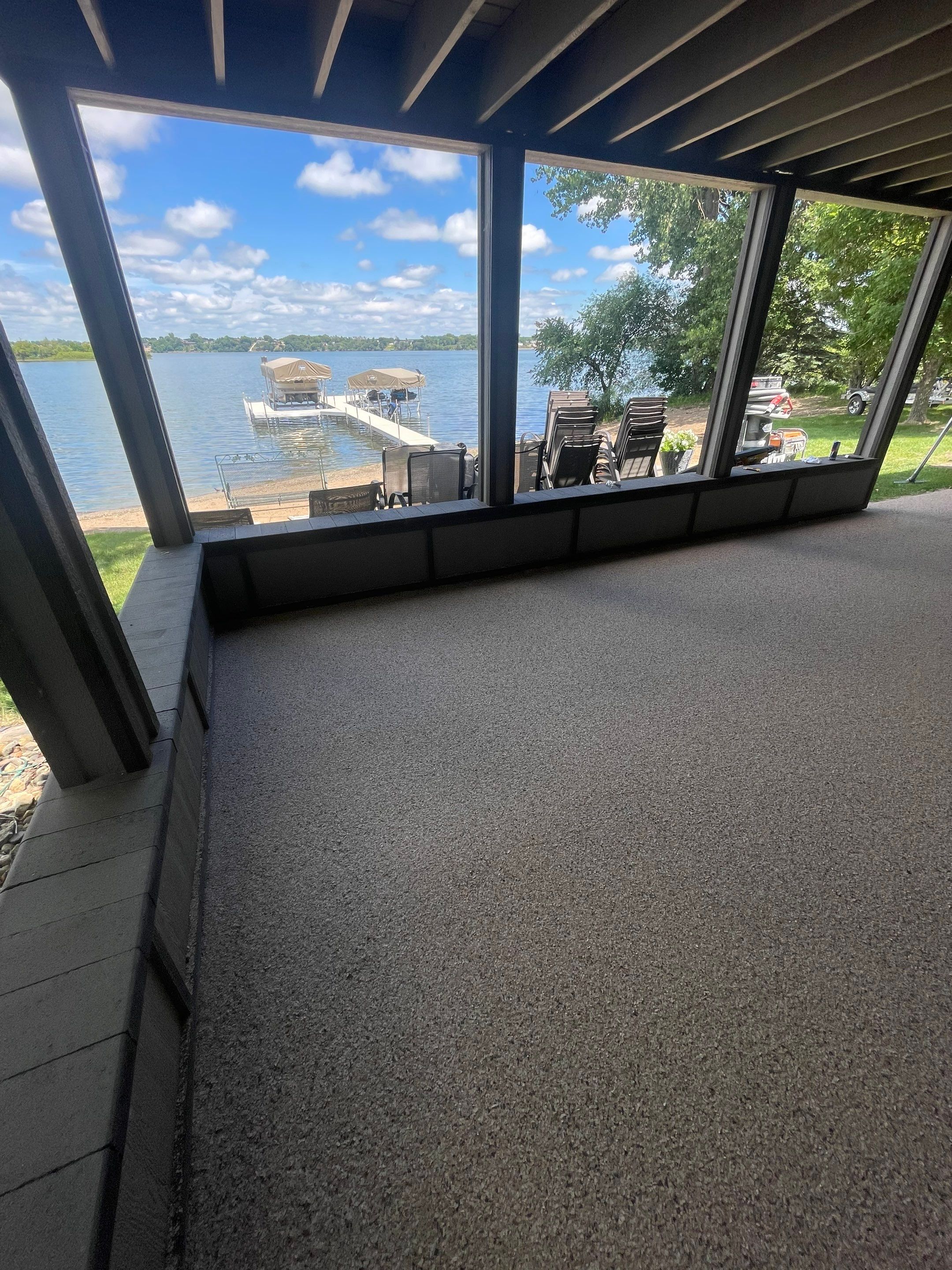 Lakefront Screened Patio Concrete Coating Installation in Wentworth by Select Painting, Coatings & Garage Cabinets