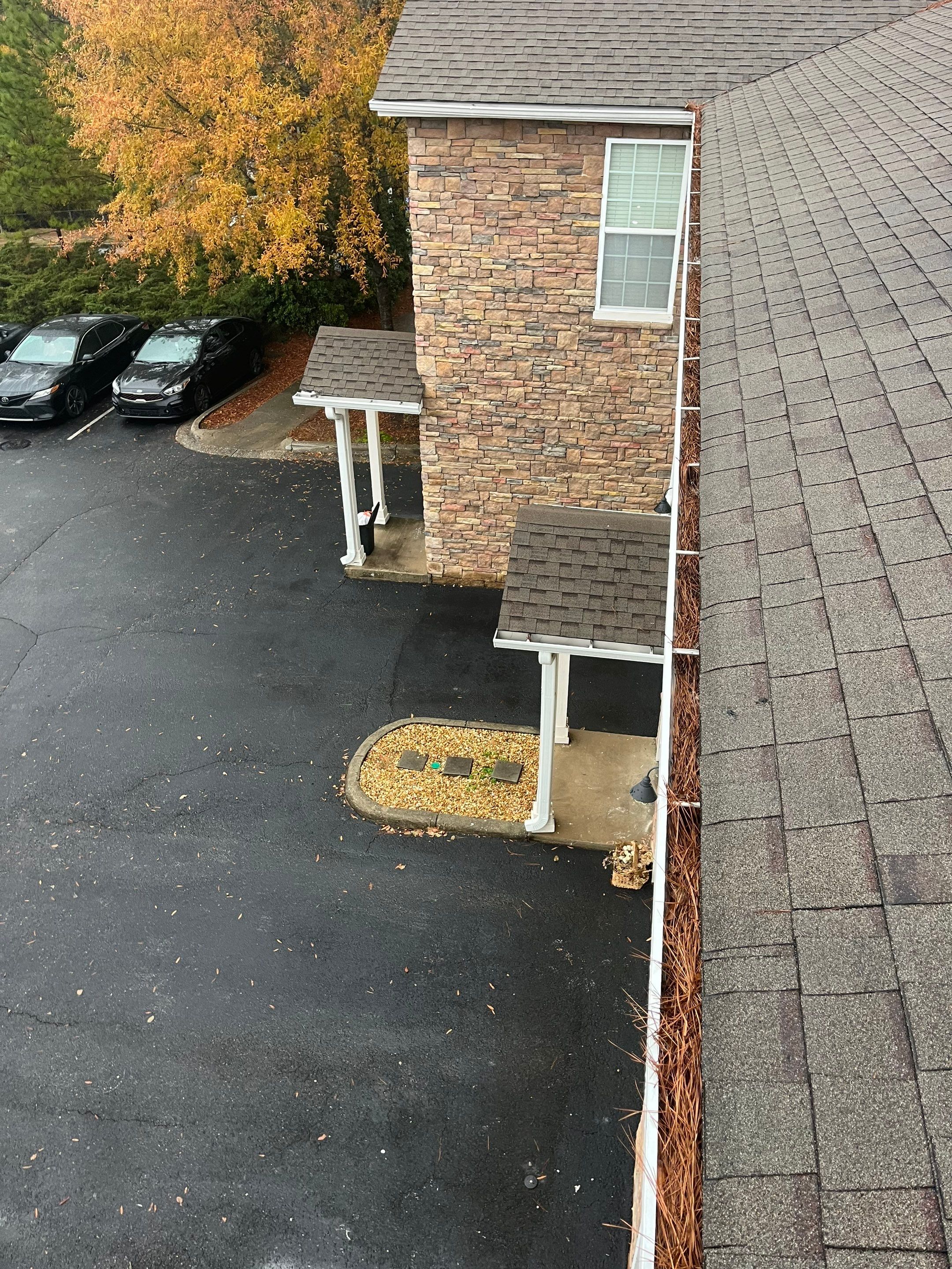Commercial gutter cleaning Birmingham, AL before photo with filled gutters