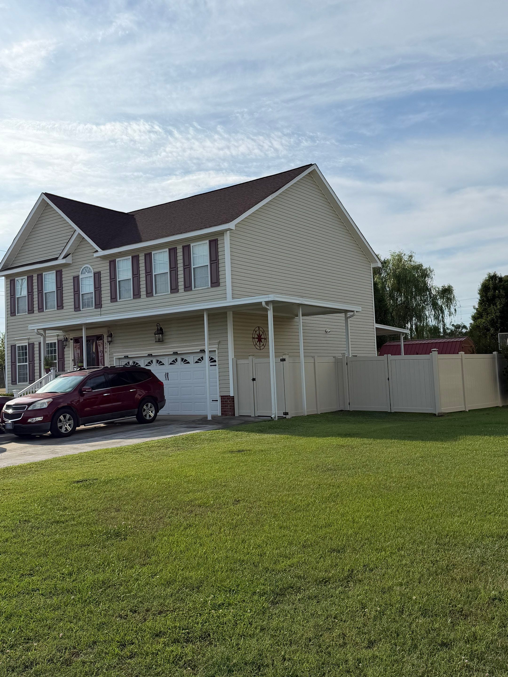 Residential Tan Vinyl Privacy Fence Installation in Winterville by Superior Fence and Rail