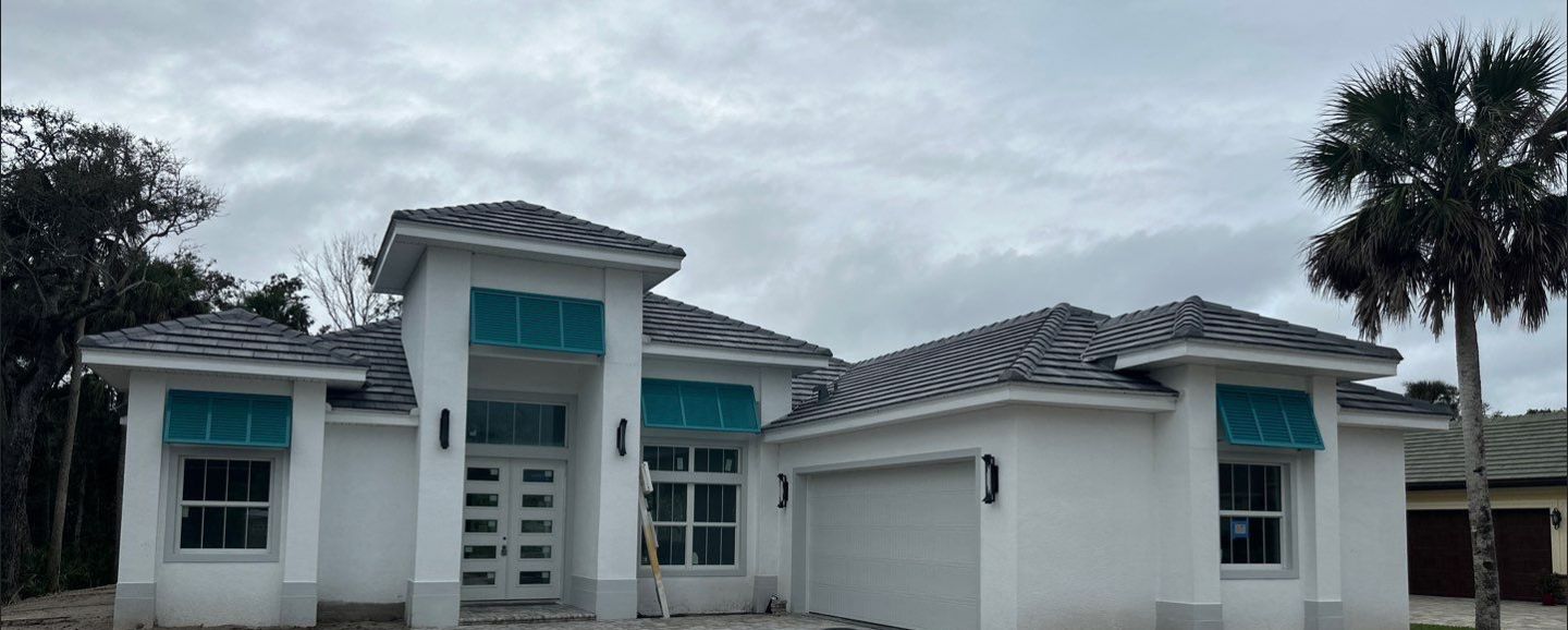 Bahama Shutters in Turquoise Blue  by Smart Guard Shutters