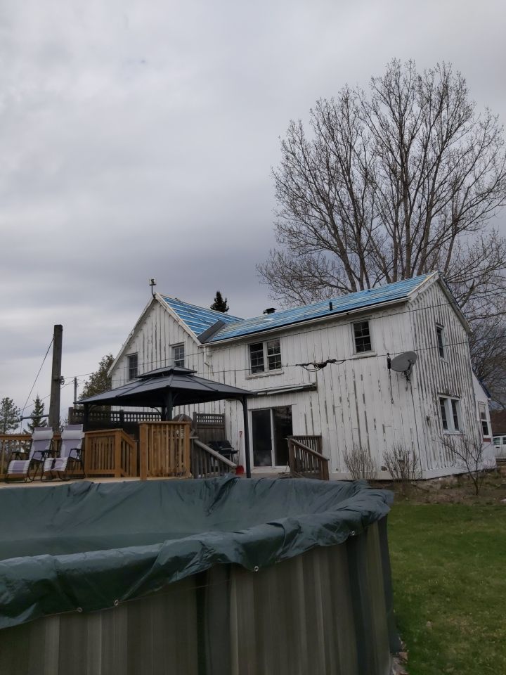 Residential Roofing Installation using 16" Standing Seam Panels by Jay Carter Roofing & Sheet Metal