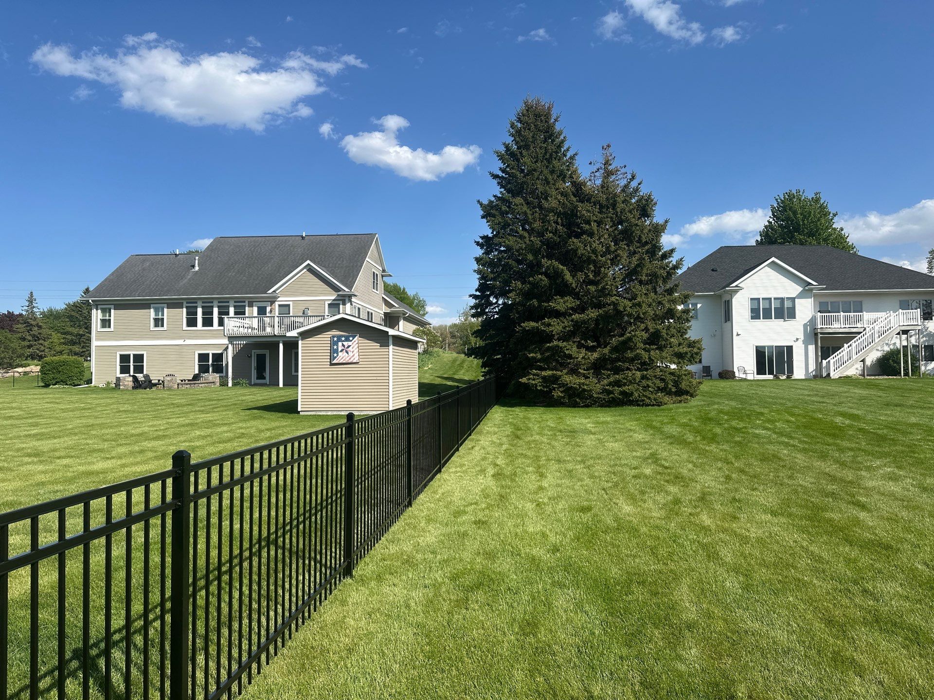 Black Ornamental Metal Picket Fence Installation in Waterloo by Perfect Picket Fence and Stain