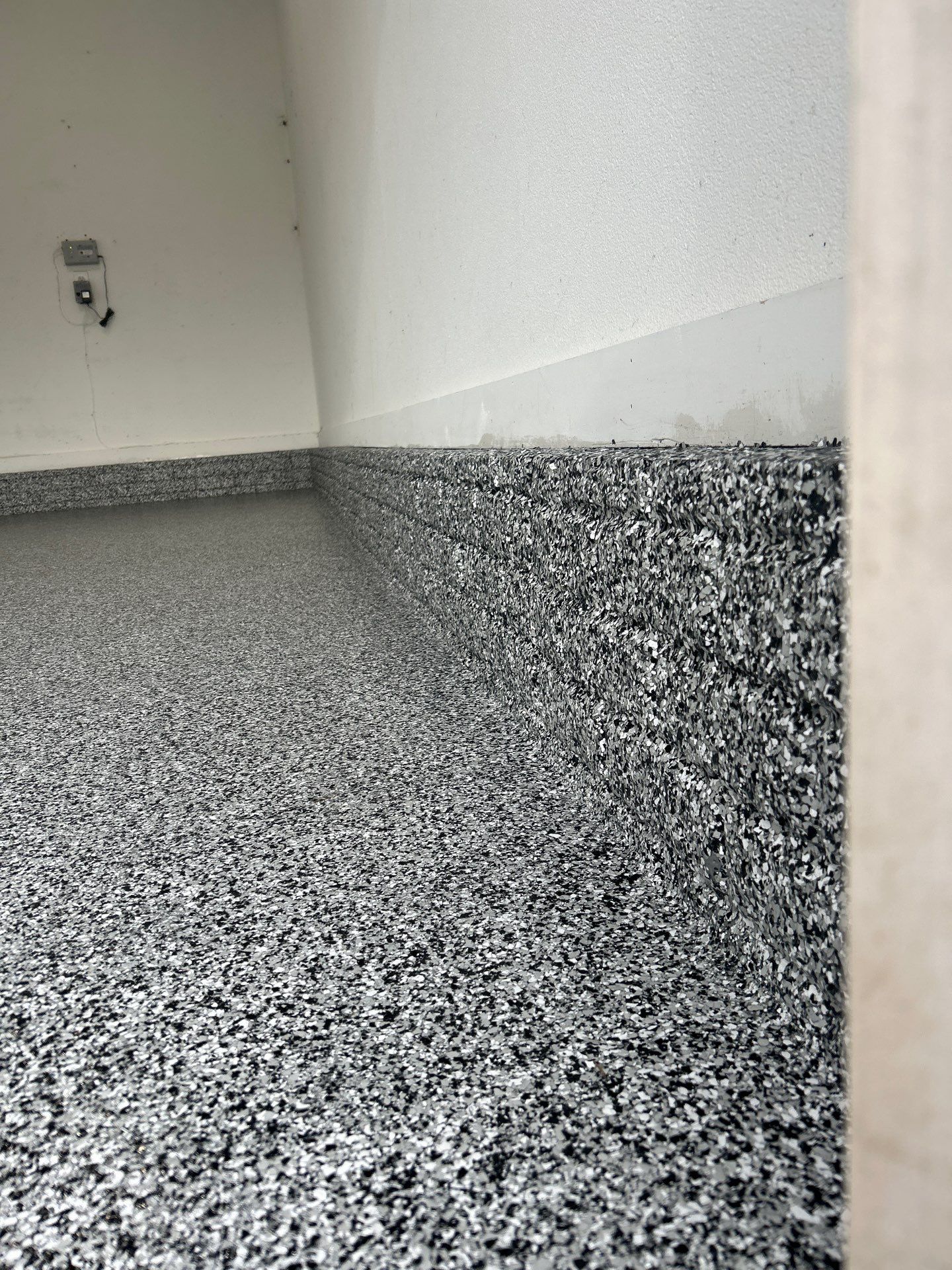 Garage Floor Coating using Domino Flake by Revival Concrete Coatings