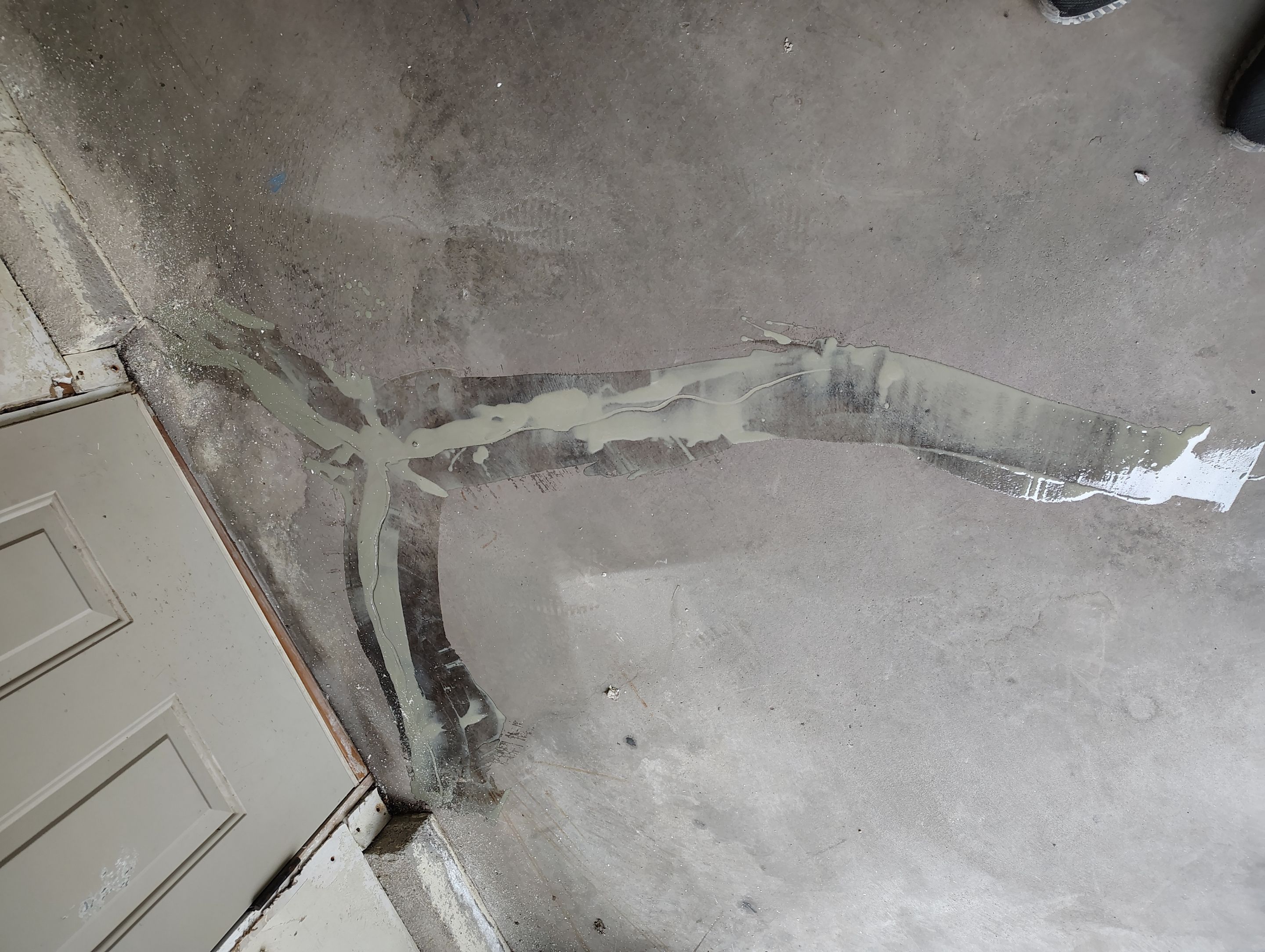Sioux Falls Garage Floor Repair and Speckled Epoxy Coating Installation by Select Painting, Coatings & Garage Cabinets