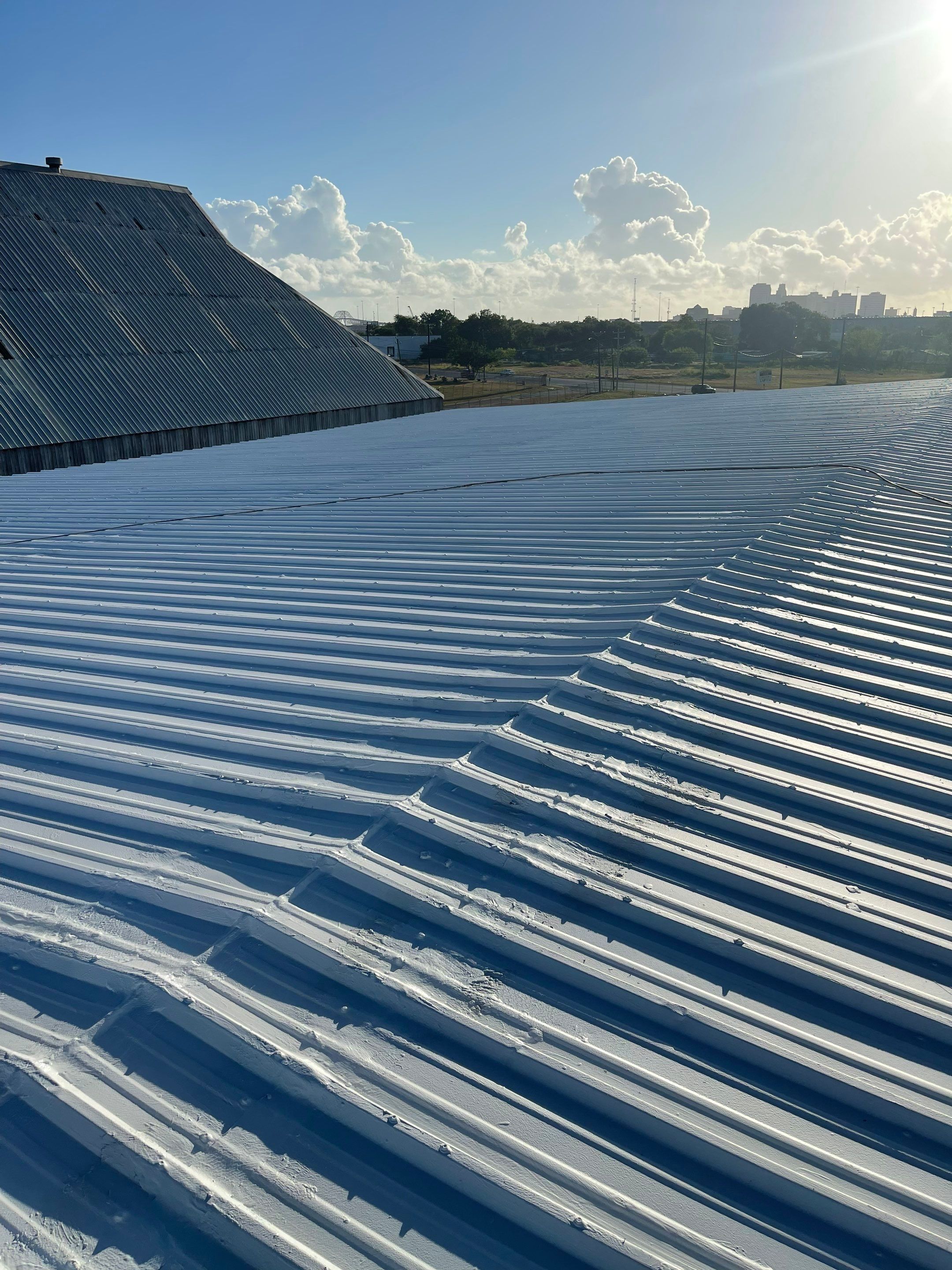 Commercial Roofing Installation using GAF 10 Year Acrylic System by Lighthouse Roofing