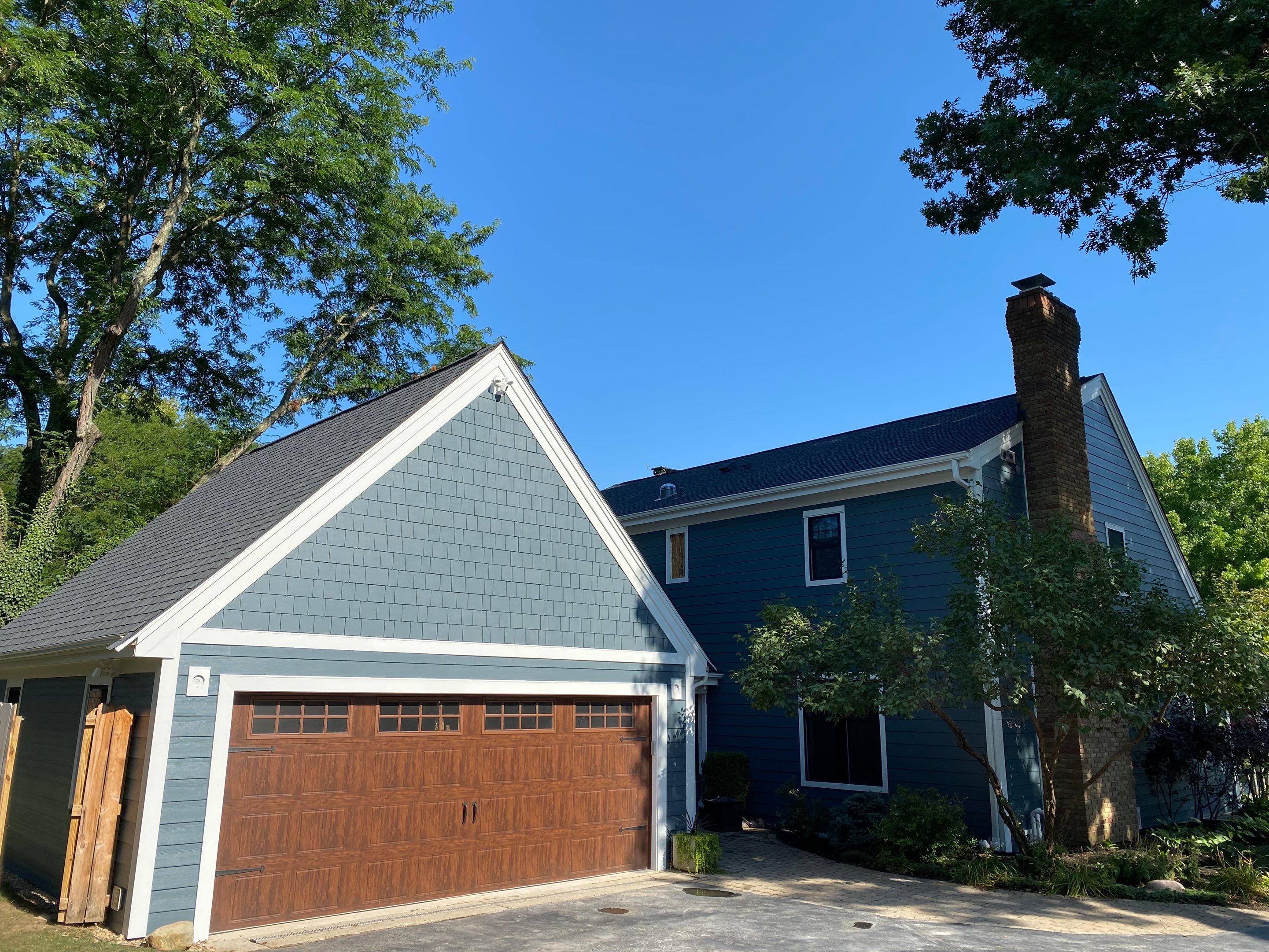 Residential Roofing Installation using James Hardie Fiber Cement Lap Siding and Certainteed Landmark Pro Shingles by Best Exteriors Inc
