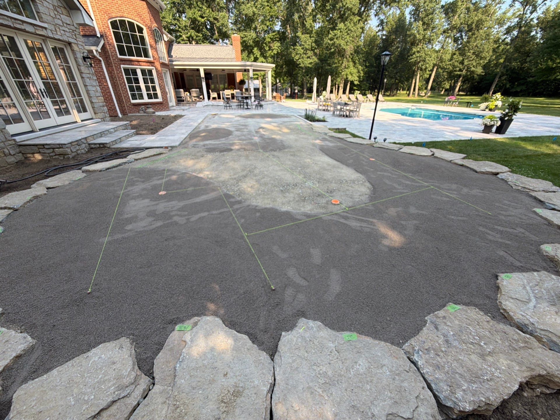 Custom Backyard Golf Green Accented by Flagstone Border in Morrow, OH by Southwest Greens Midwest