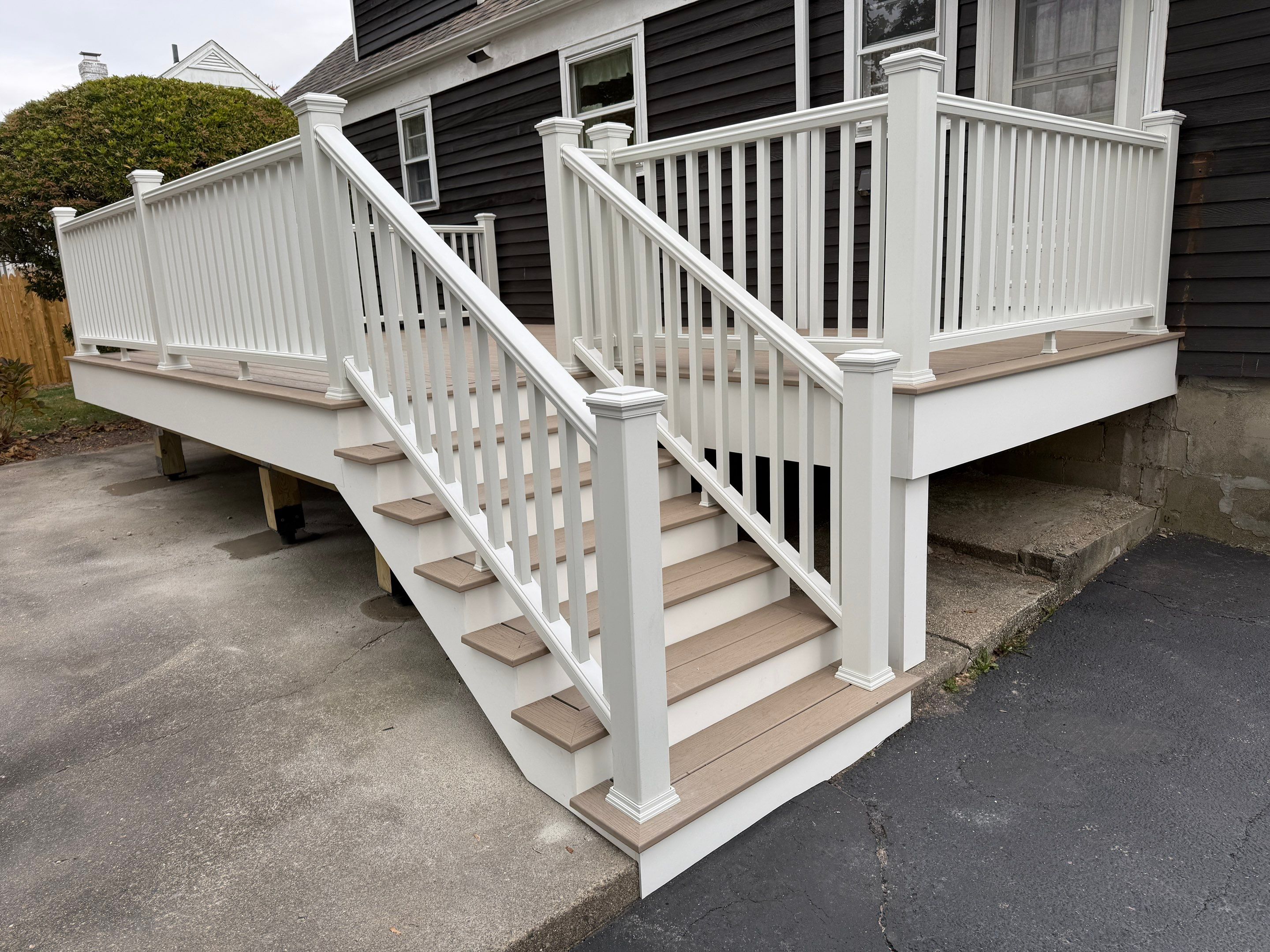 Deck replacement, using Trex Transcend Rope Swing, Transcend railings with ada graspable handrail. in white. by DiGiorgi Roofing and Siding Inc