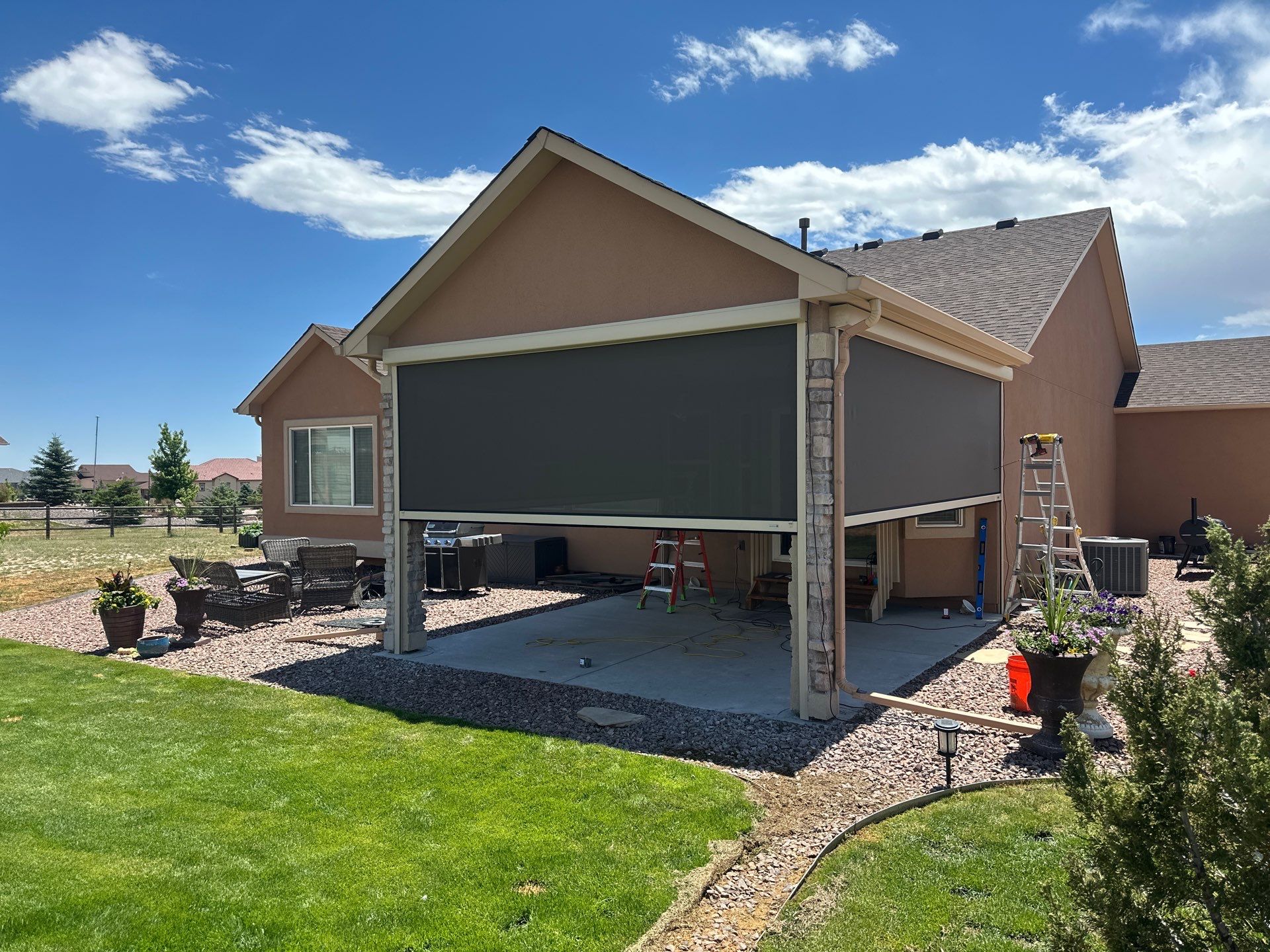 MagnaTrack Outdoor Screen Installation for a Covered Patio in Peyton by Outdoor Solutions Colorado