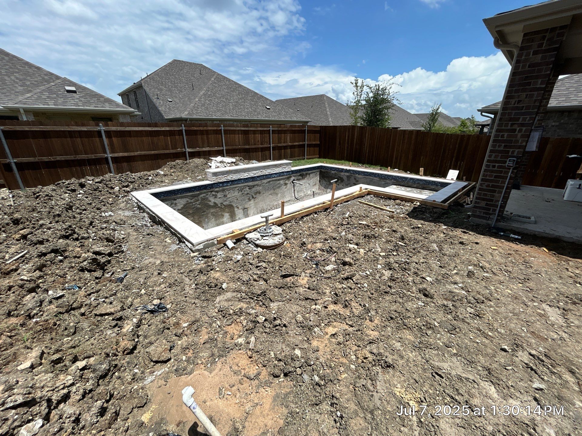Sleek Geometric Pool with Tanning Ledge and Turf by Pinnacle Pools and Spas - DFW