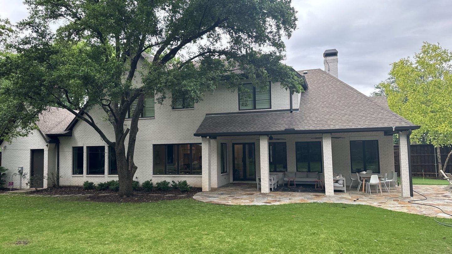 White brick with GAF Weathered Wood by Tejas Roofworks + Restoration