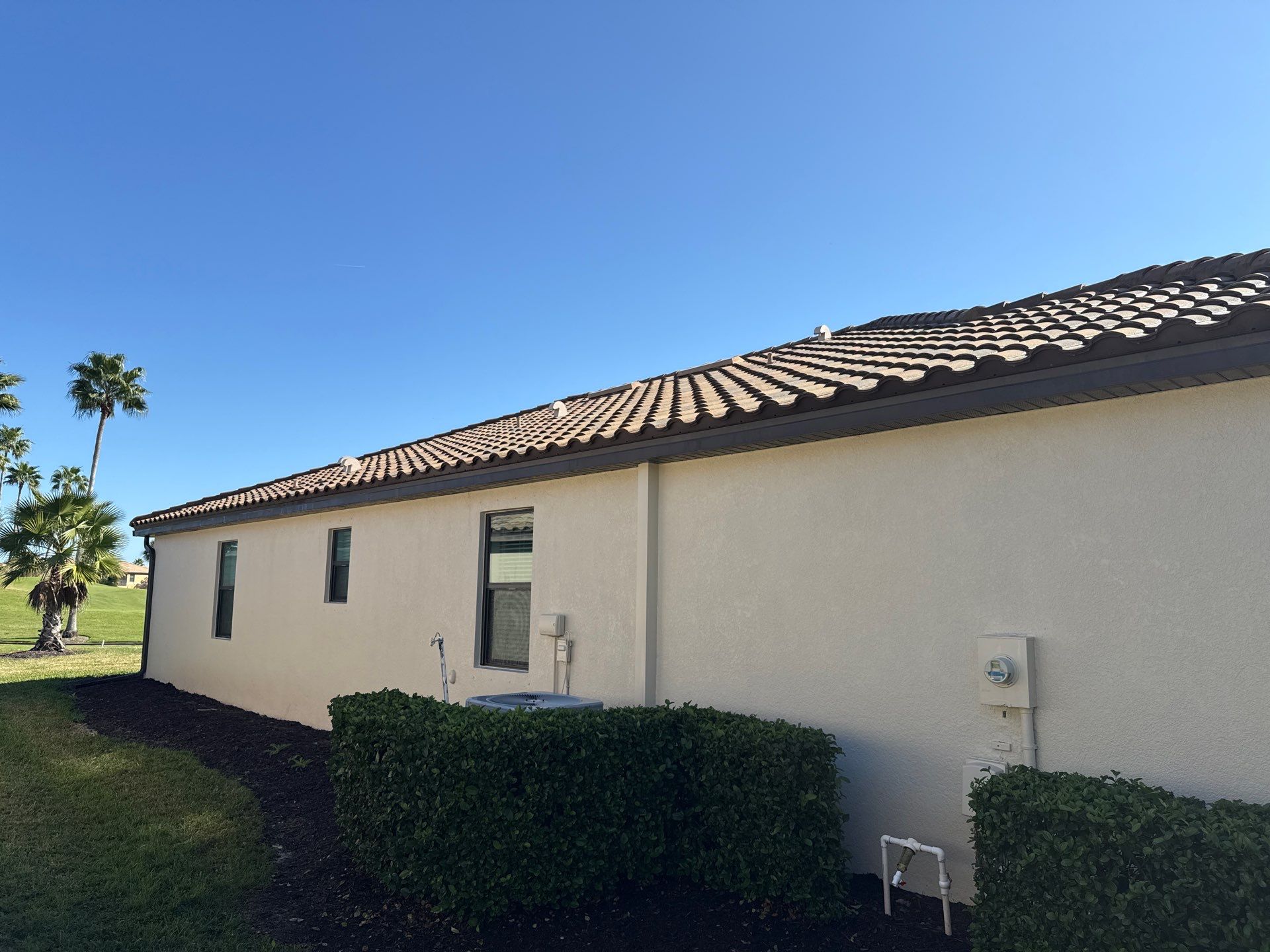 Barrel Tile Roof Cleaning & Paver Driveway Cleaning in River Strand at Heritage Harbour | Bradenton, FL by Sunshine AquaWash