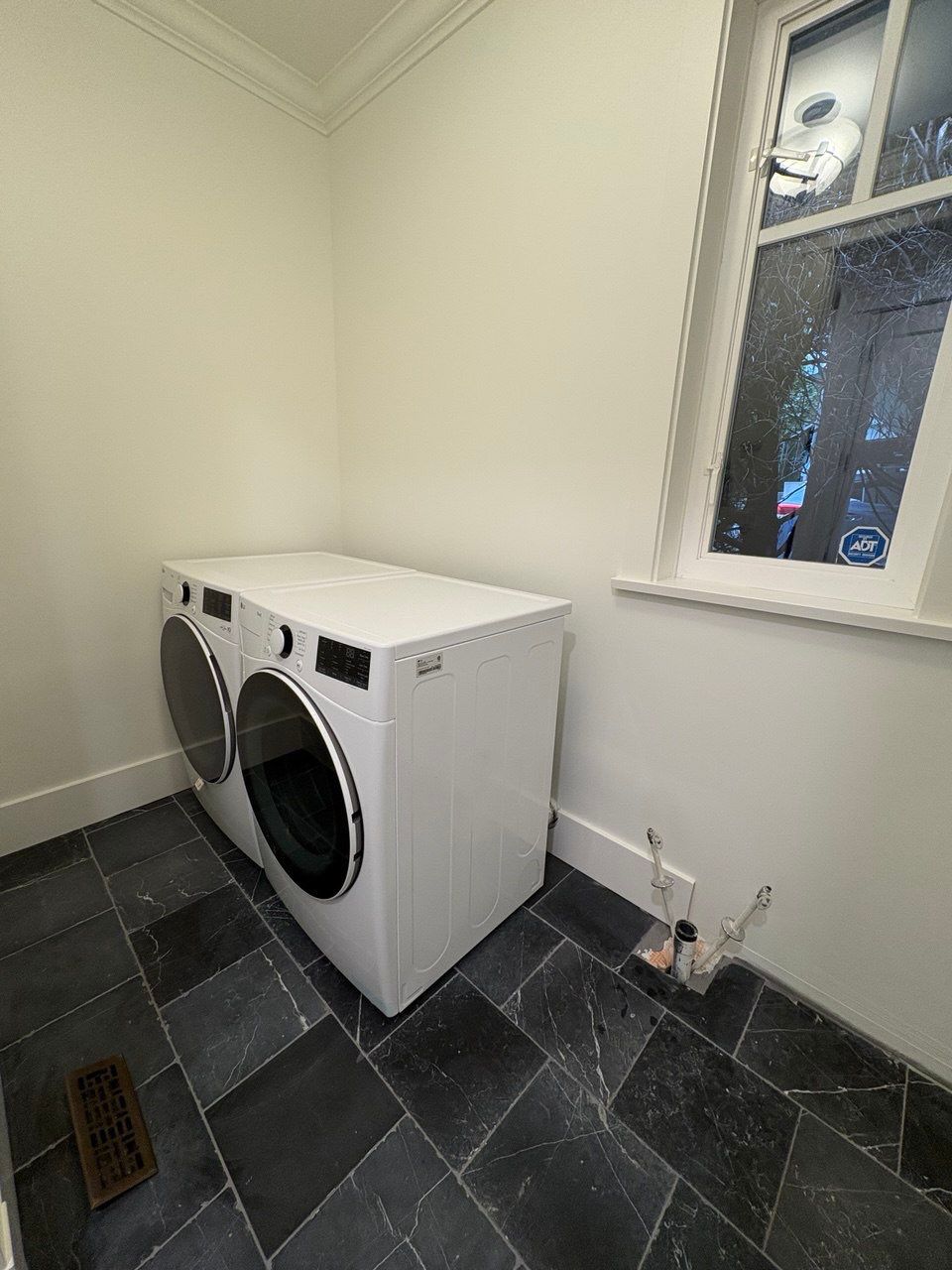 High-End Laundry Room Renovation and Restoration in Vancouver by YVR Construction Group