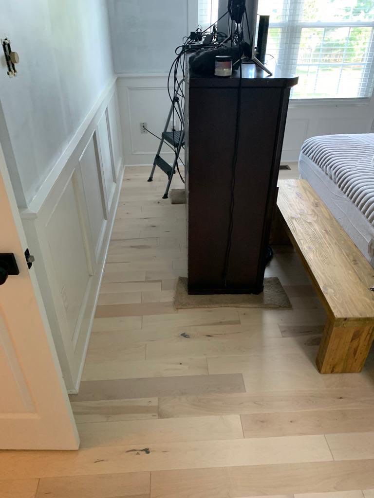 Flooring Installation using Maple Hardwood by Greenspring Construction Services
