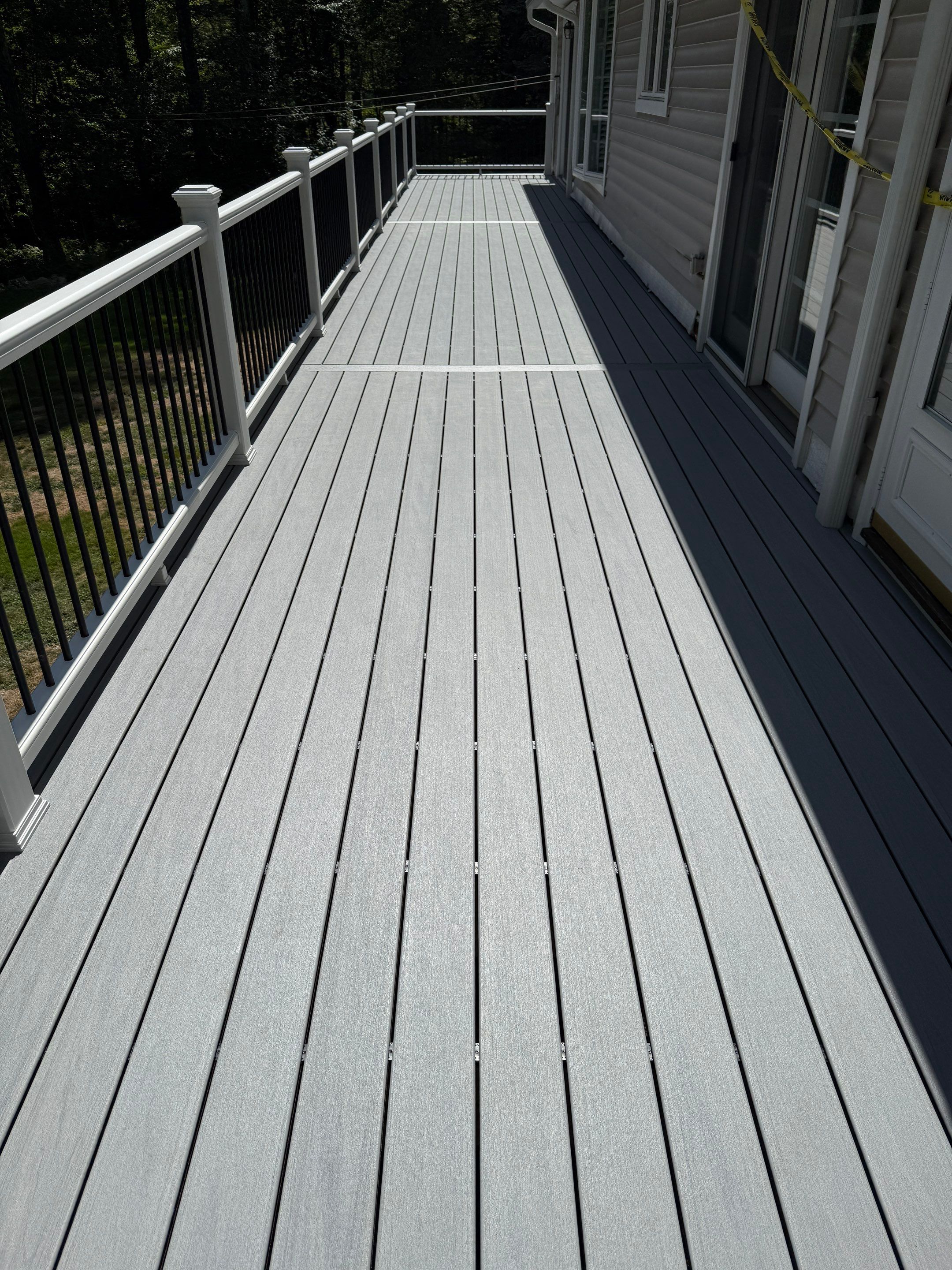 Replacement of front and back decks using Trex Lineage Island mist and Trex Lineage Rainier by DiGiorgi Roofing and Siding Inc