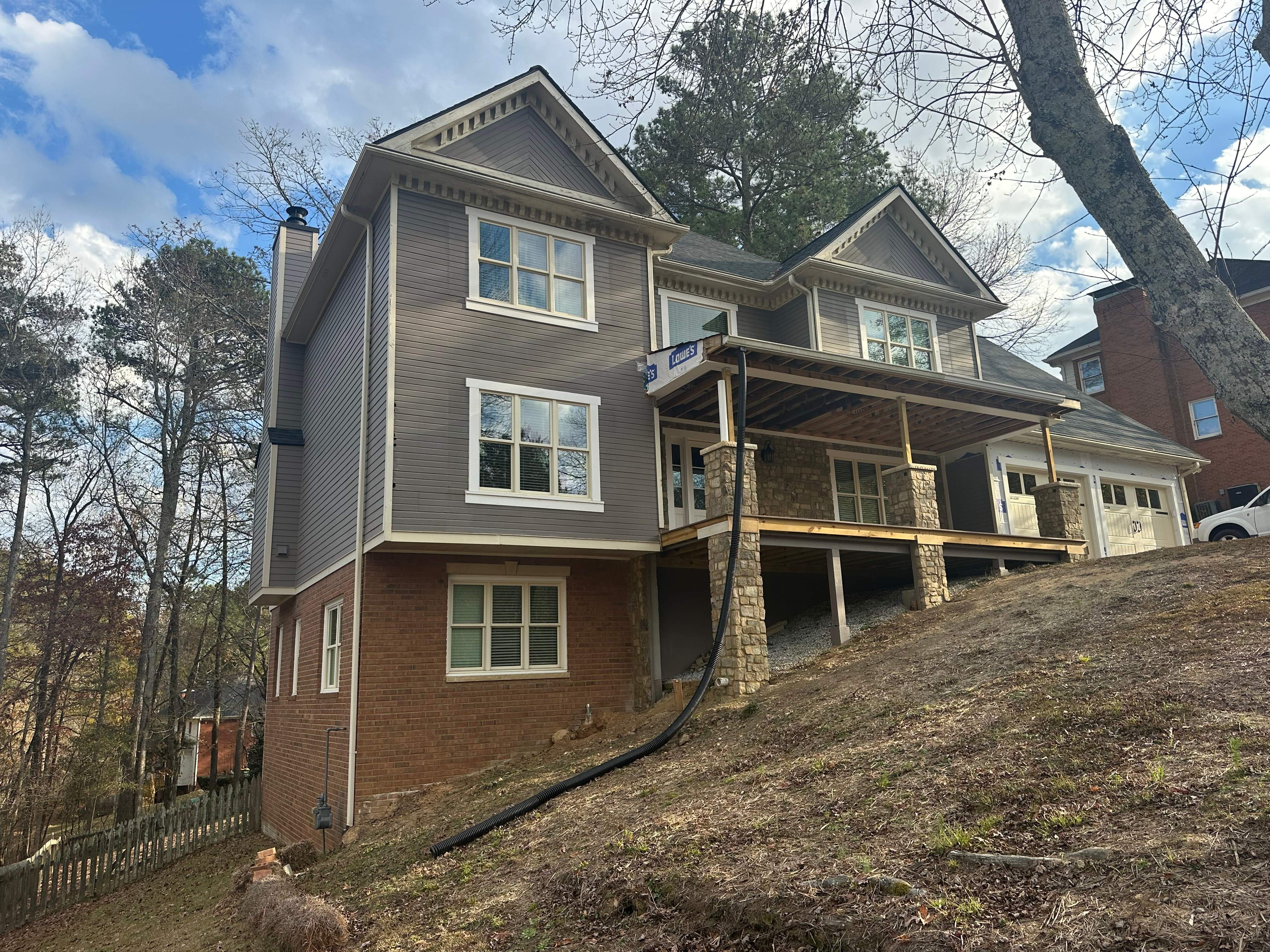 James Hardie Siding Replacement, Exterior Painting, Deck Stain, and Gutter Installation in Peachtree Corners, GA by Nelson Exteriors
