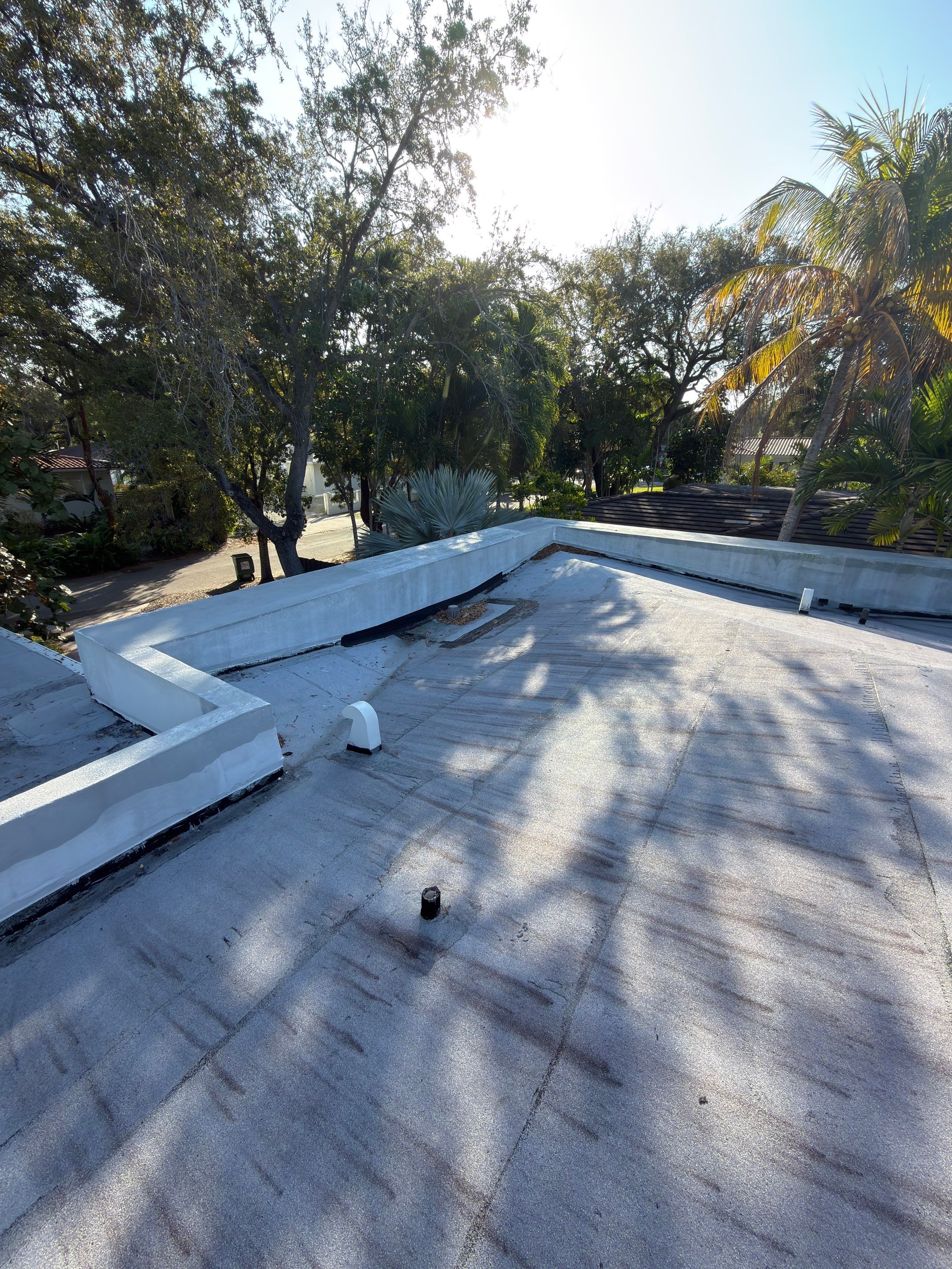 Flat Roof Silicone Coating and Interior Water Damage Restoration in Miami by Picos Construction Engineering
