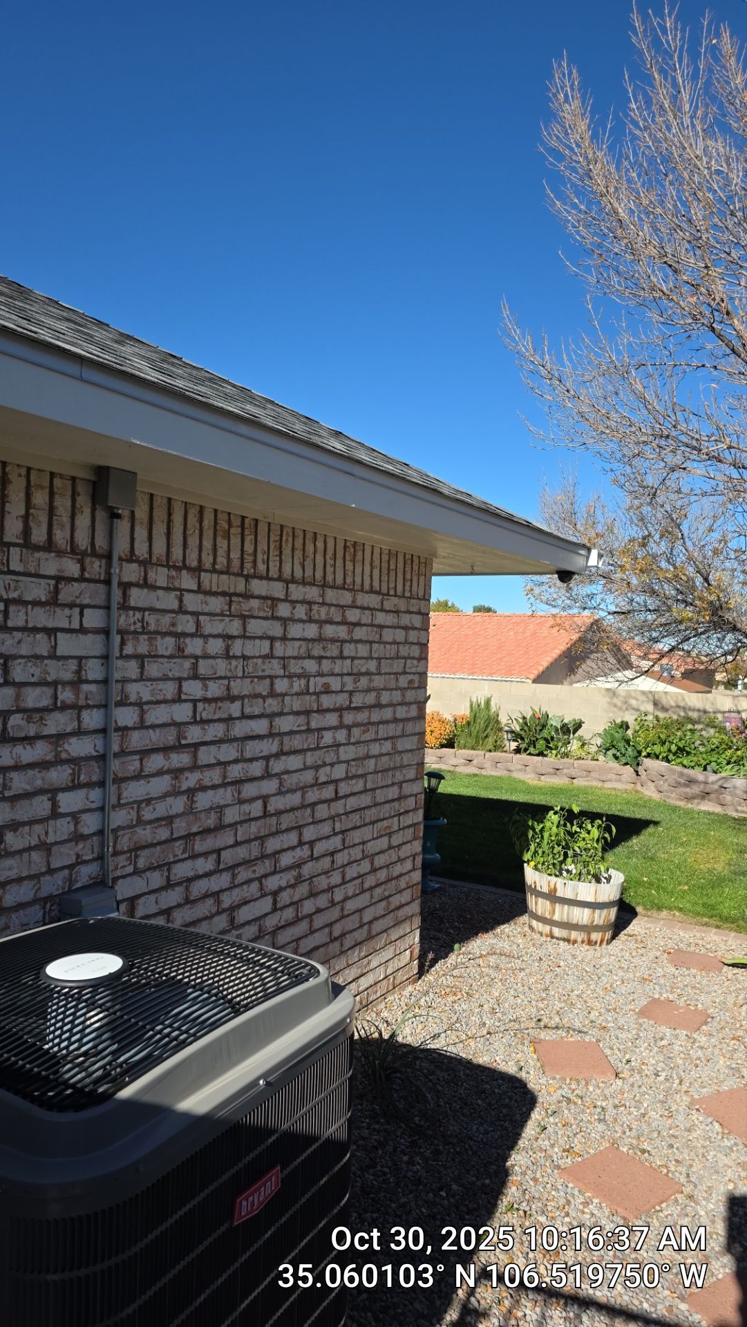 Seamless White Gutter and Downspout Installation in Albuquerque by Doyle Roof Masters Inc