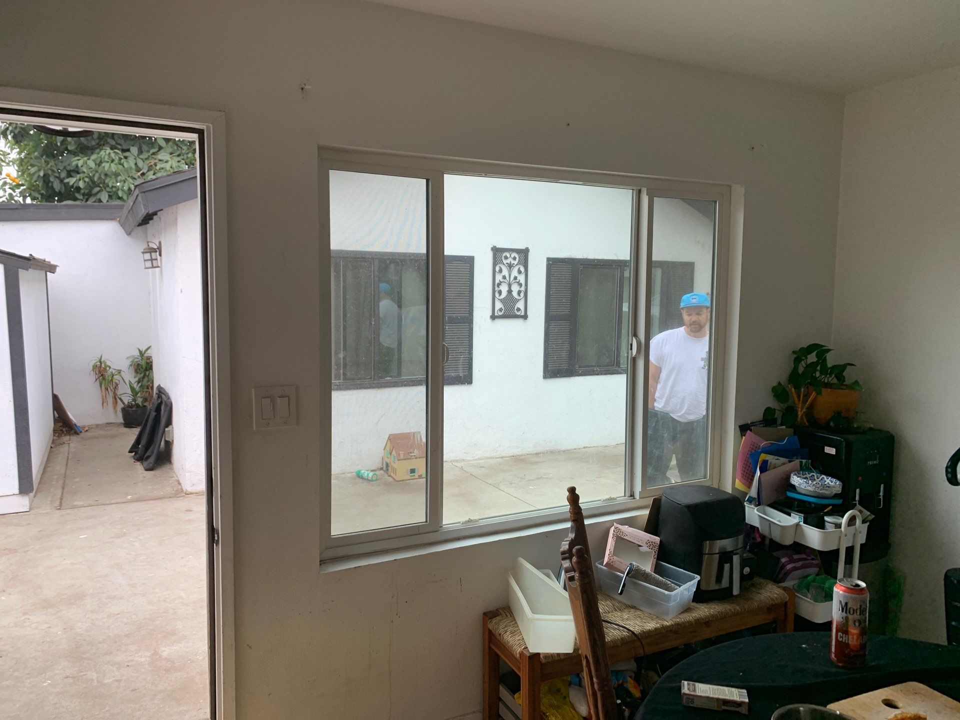 Window Installation using black Vinyl Windows by American Window Company