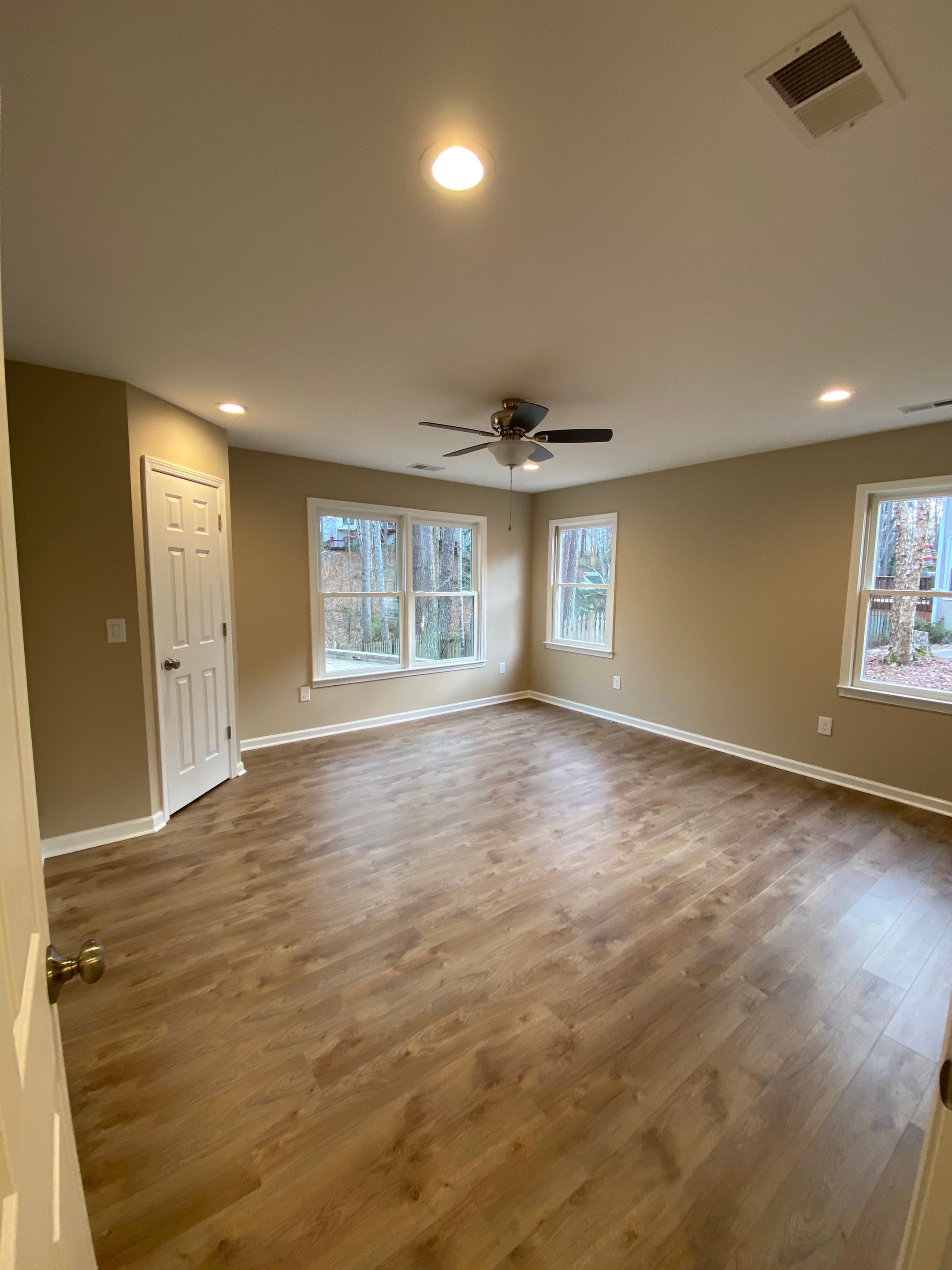 Acworth Basement Transformation With Wet Bar and Stone Fireplace by Swift Home Renovations