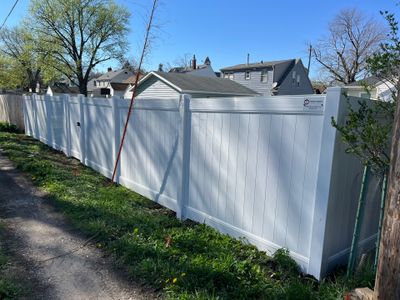Residential White Vinyl Privacy Fence Installation in Waterloo, Iowa
