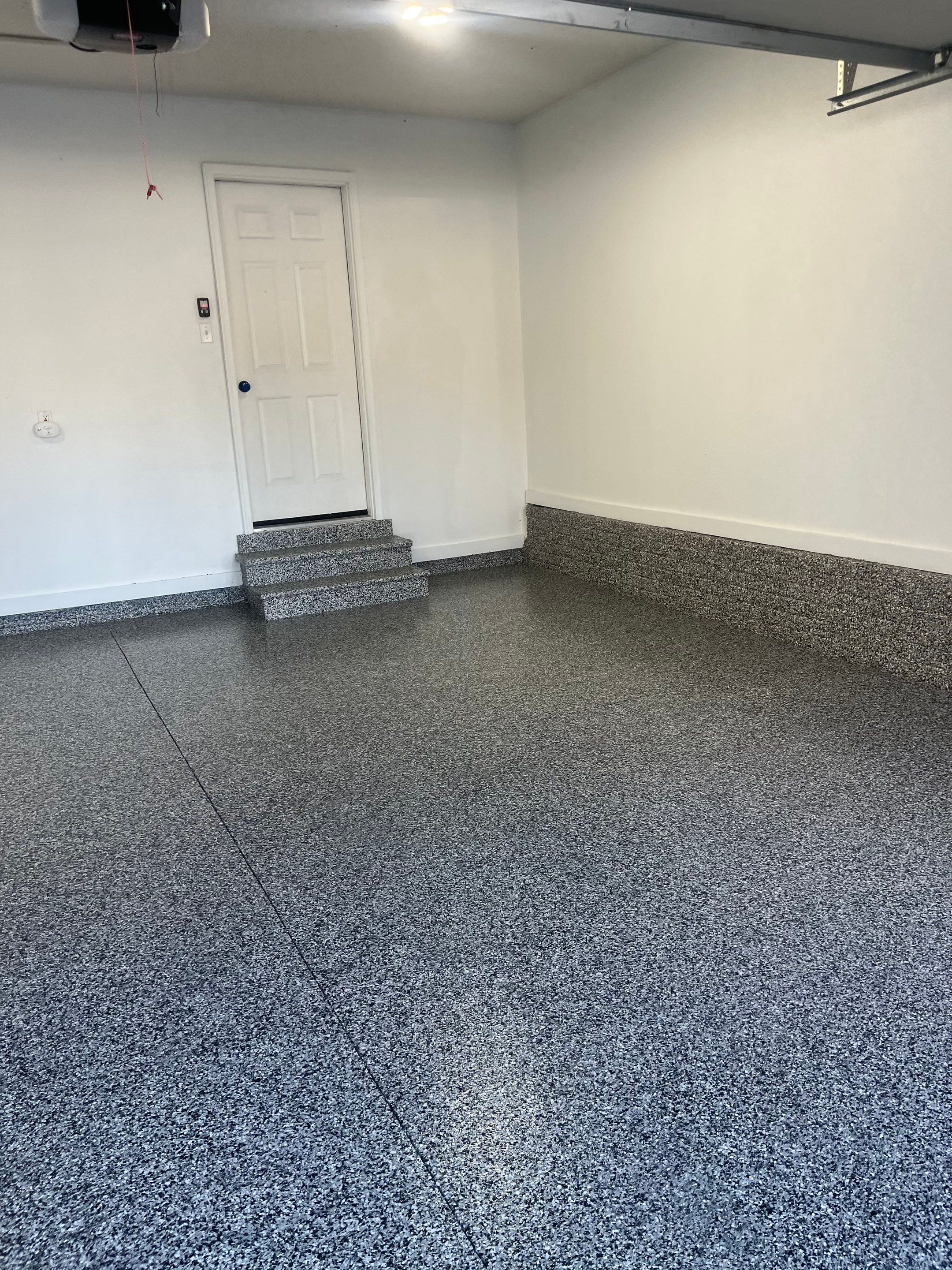 Johnston Garage Coating in Domino by Revival Concrete Coatings, LLC