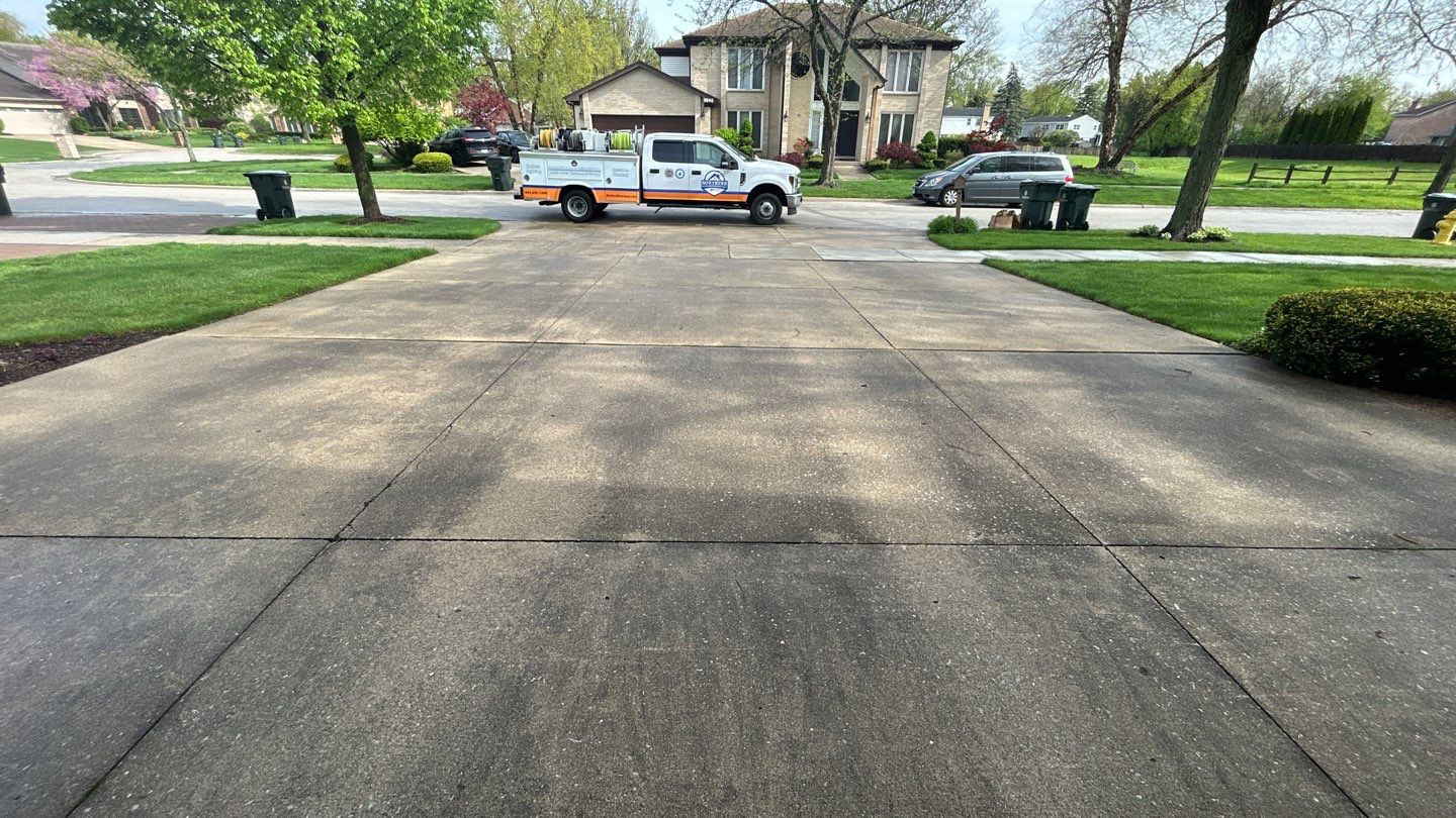 concrete patio and driveway cleaning by Northern Power Washing LLC.