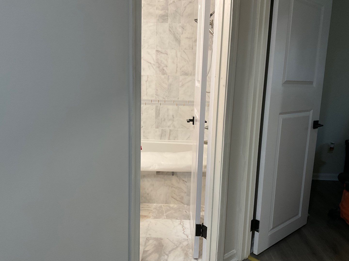 Bathroom Remodel using Two new bathroom design and new floors by Alpha Design Services